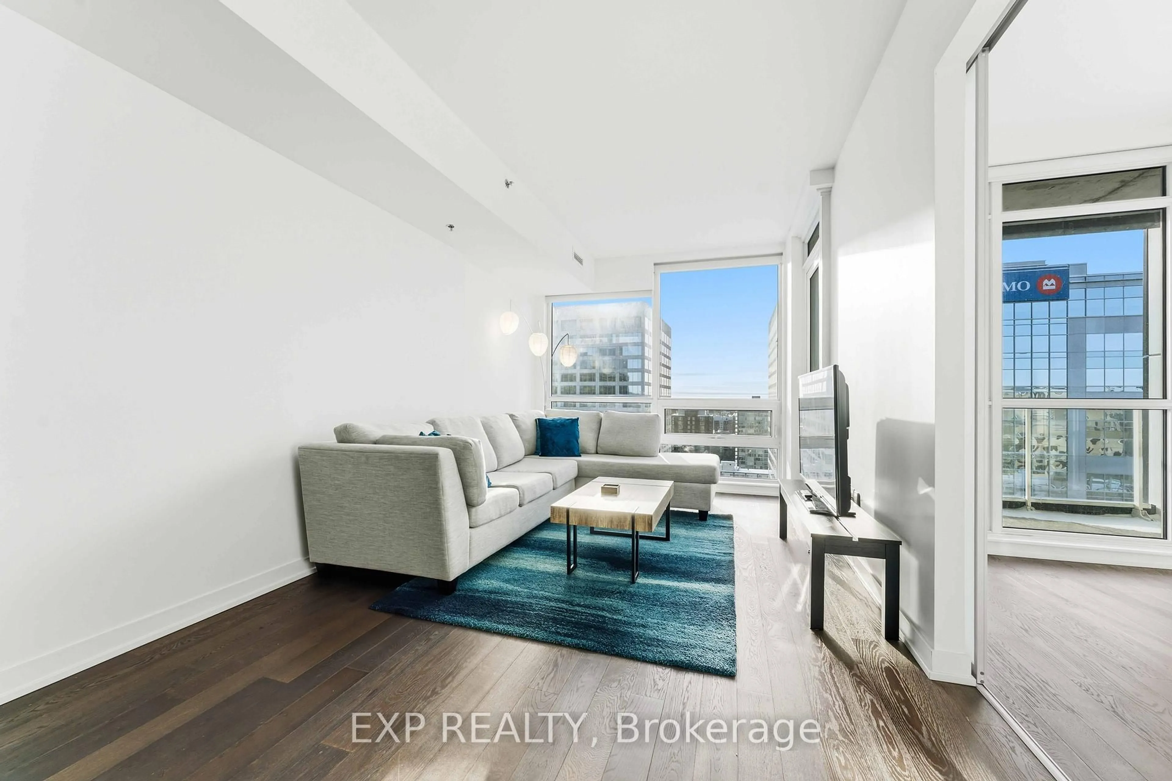 Living room with furniture, wood/laminate floor for 199 Slater St #2102, Ottawa Ontario K1P 0C8