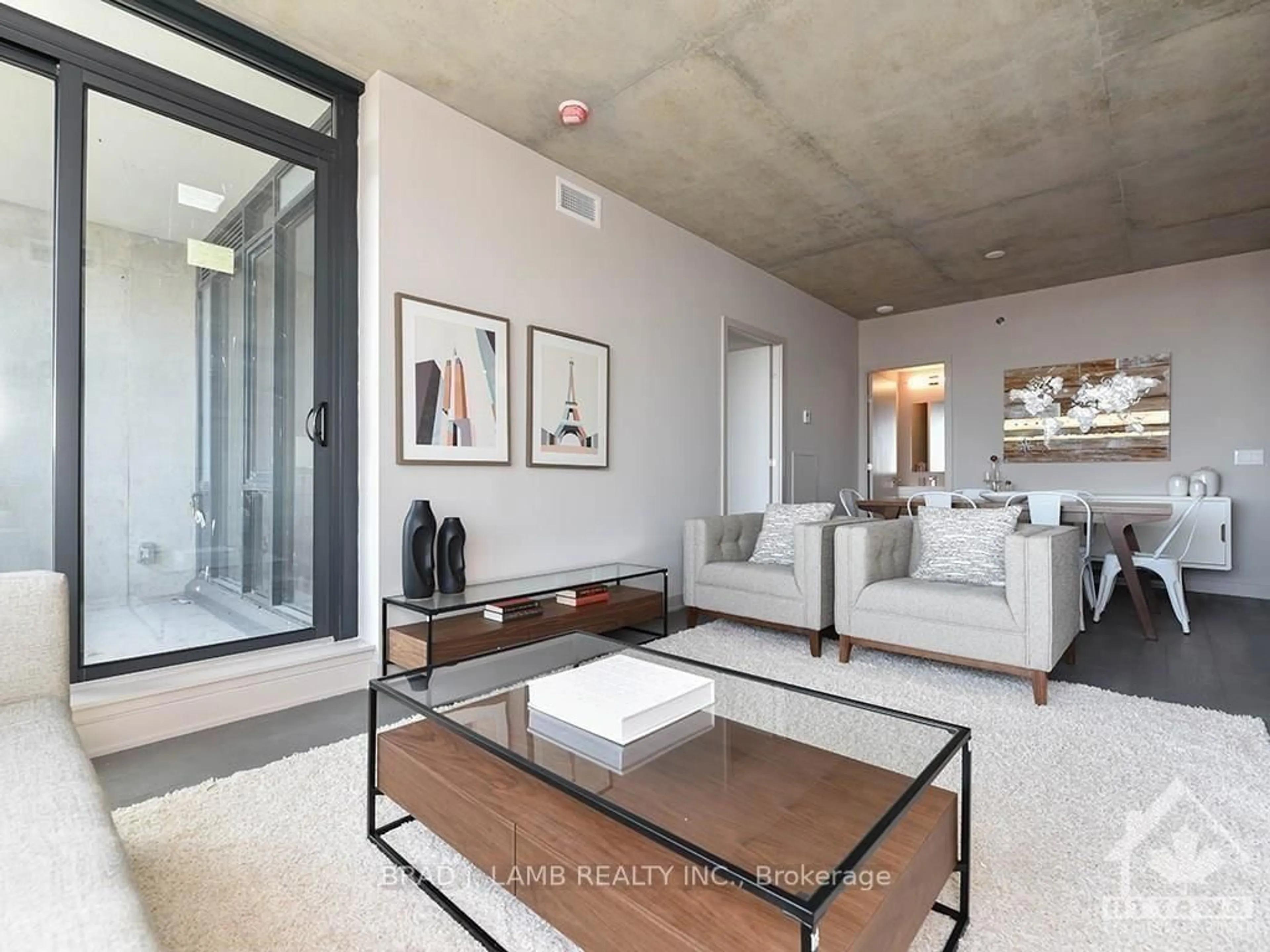 Living room with furniture, cement floor for 203 CATHERINE St #209, Ottawa Ontario K2P 1J5