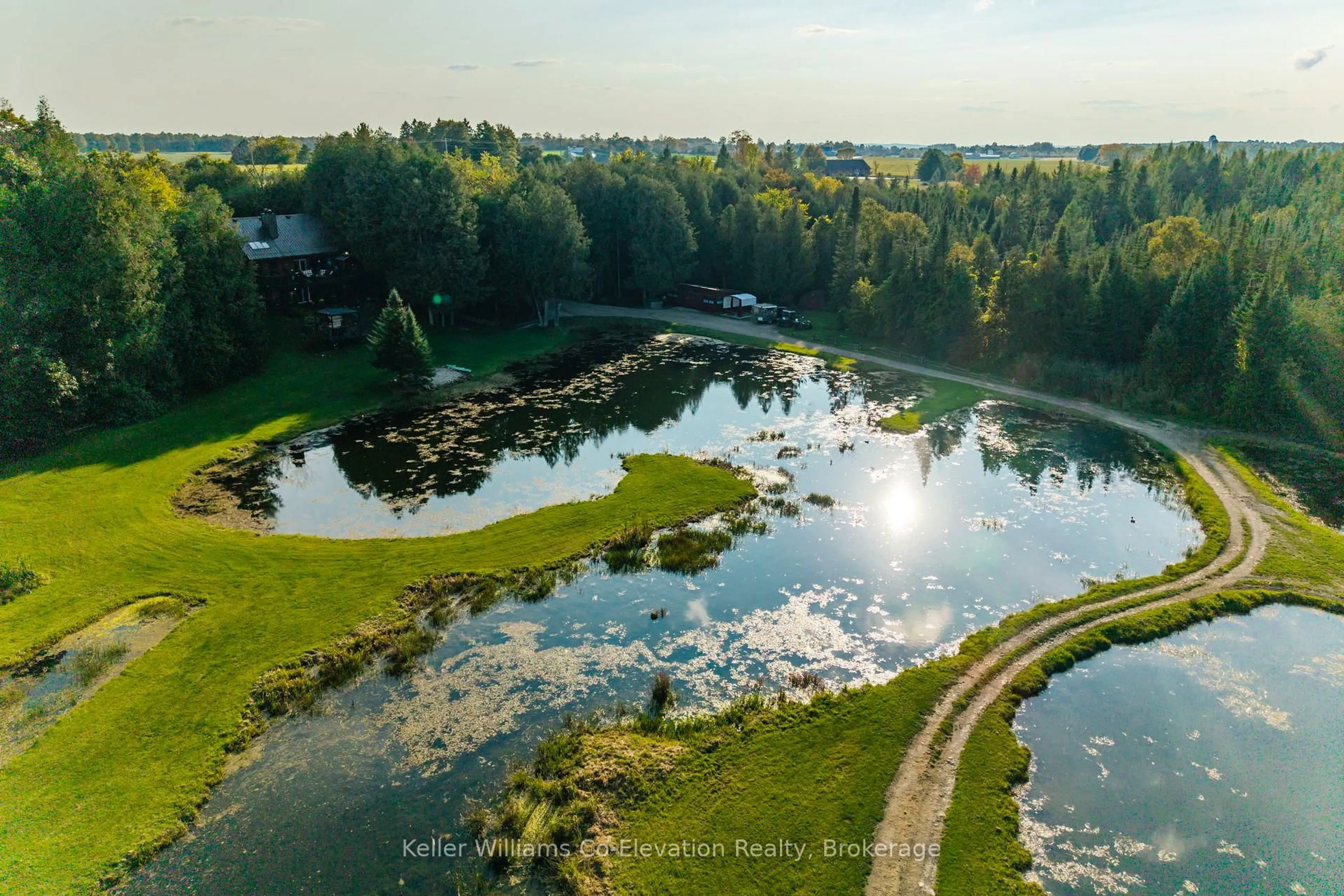 A pic from outside/outdoor area/front of a property/back of a property/a pic from drone, water/lake/river/ocean view for 407047 Grey 4 Rd, Grey Highlands Ontario N0C 1E0