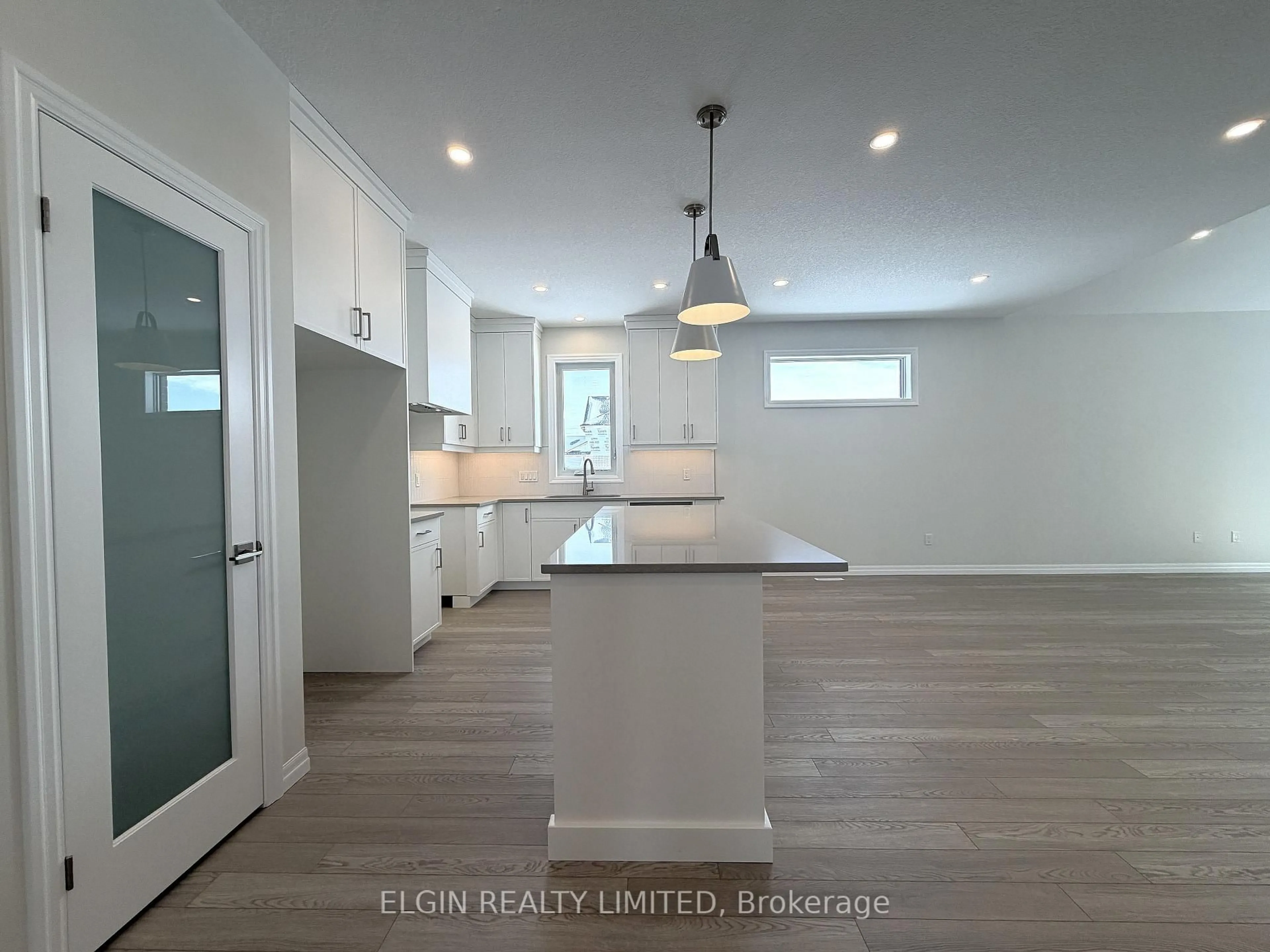 Open concept kitchen, wood/laminate floor for 253 Renaissance Dr, St. Thomas Ontario N5R 0P9