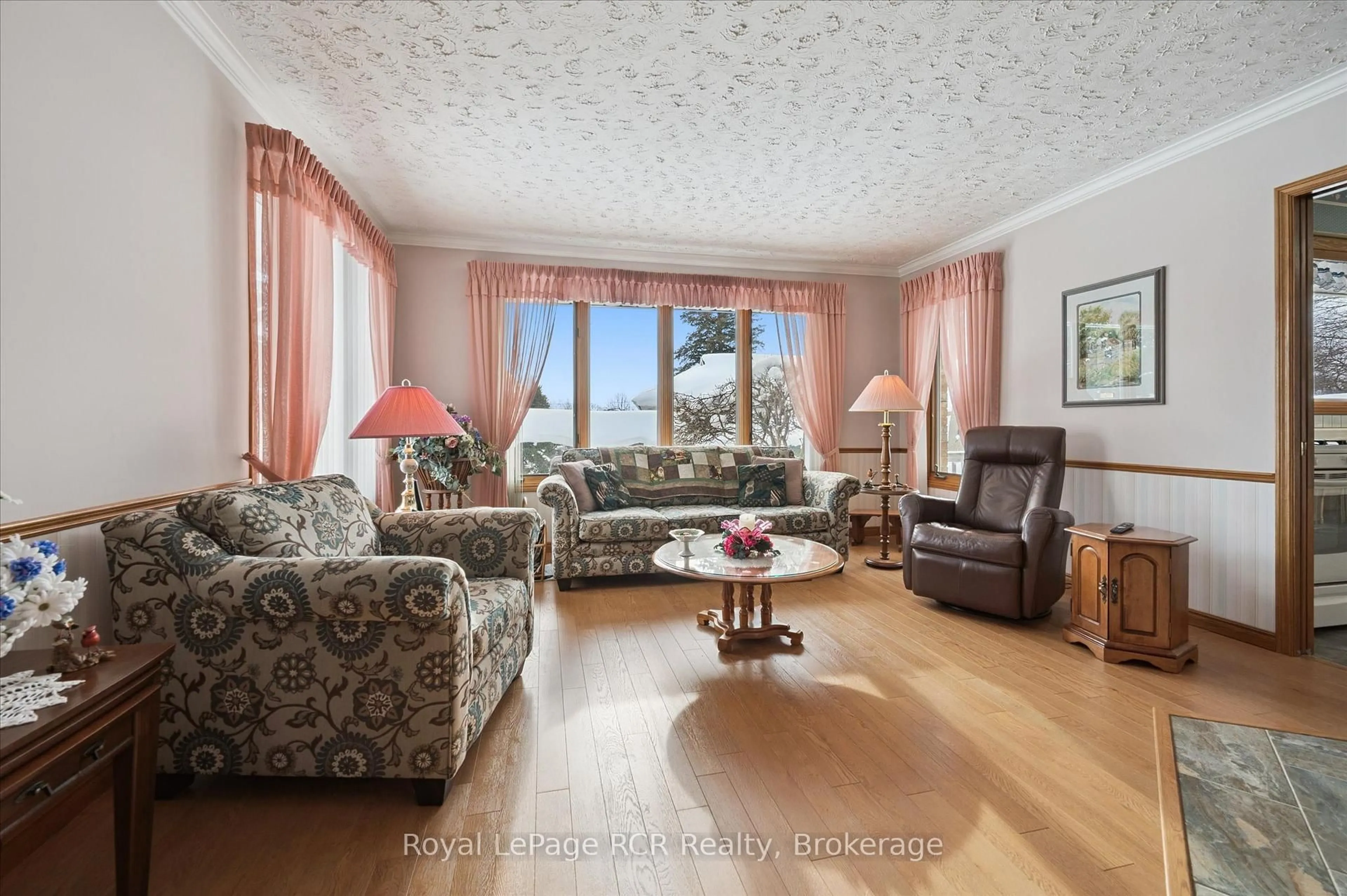 Living room with furniture, wood/laminate floor for 5 Jackson Cres, North Perth Ontario N4W 1K2