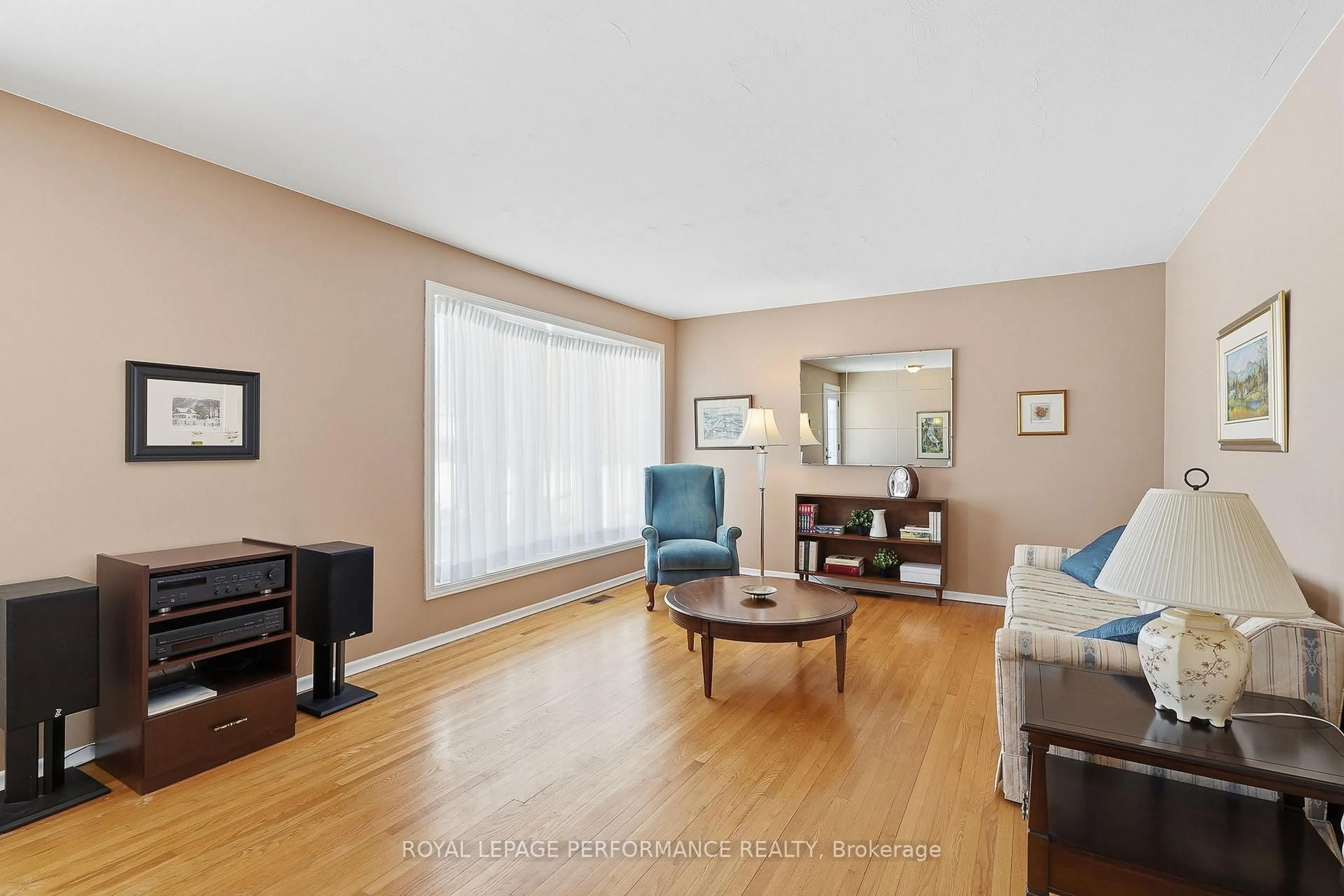 Living room with furniture, wood/laminate floor for 2266 Fife Cres, Ottawa Ontario K1G 2Z4