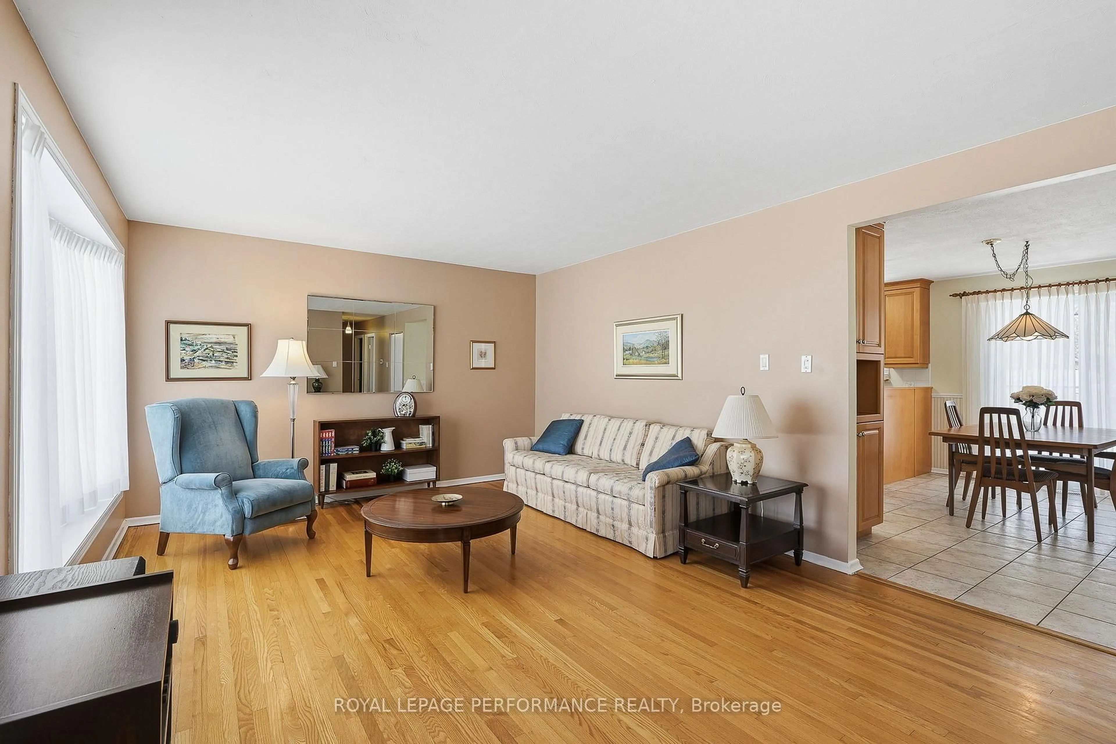 Living room with furniture, wood/laminate floor for 2266 Fife Cres, Ottawa Ontario K1G 2Z4