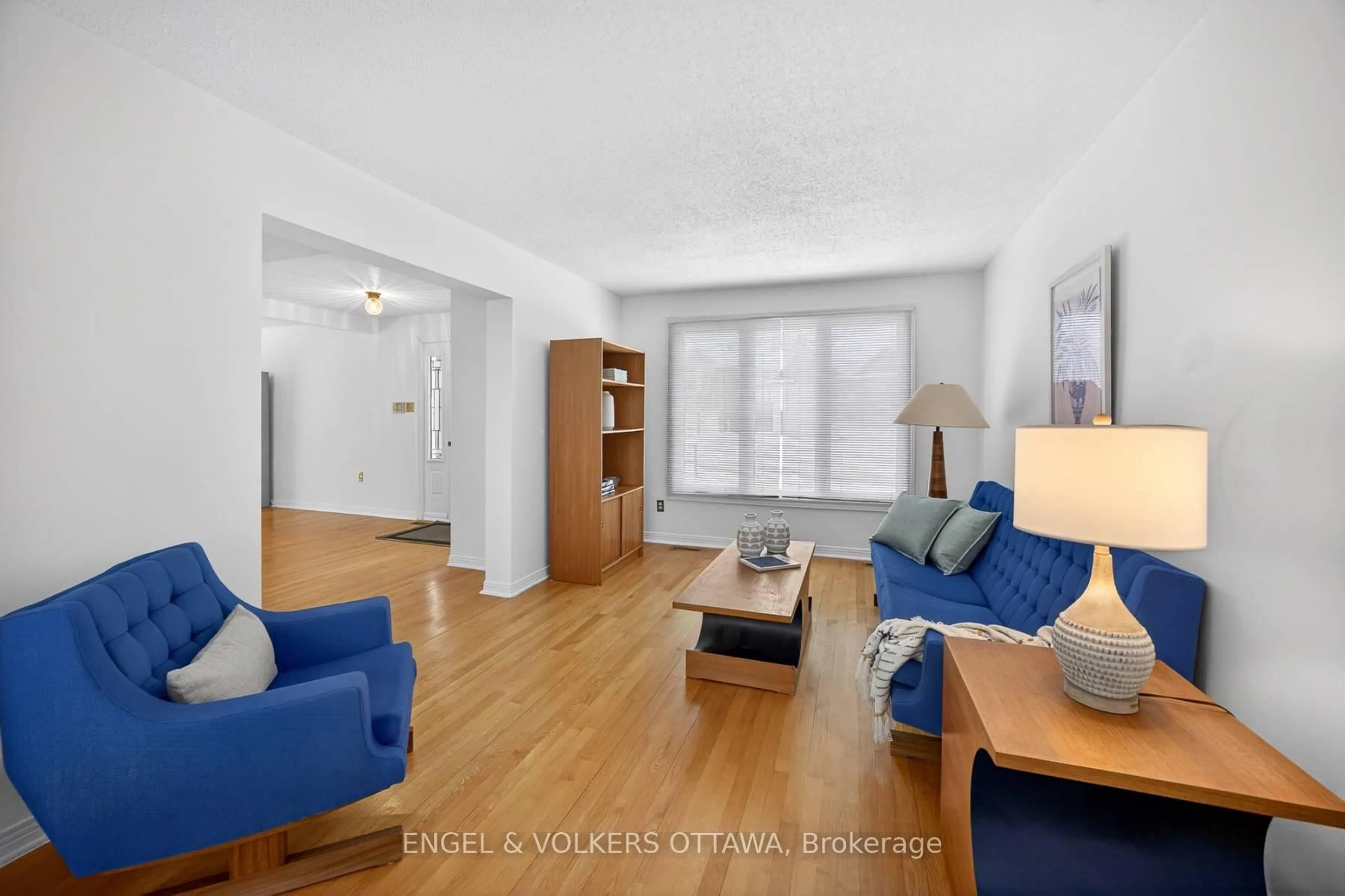 Living room with furniture, wood/laminate floor for 82 Leacock Dr, Kanata Ontario K2K 2A8