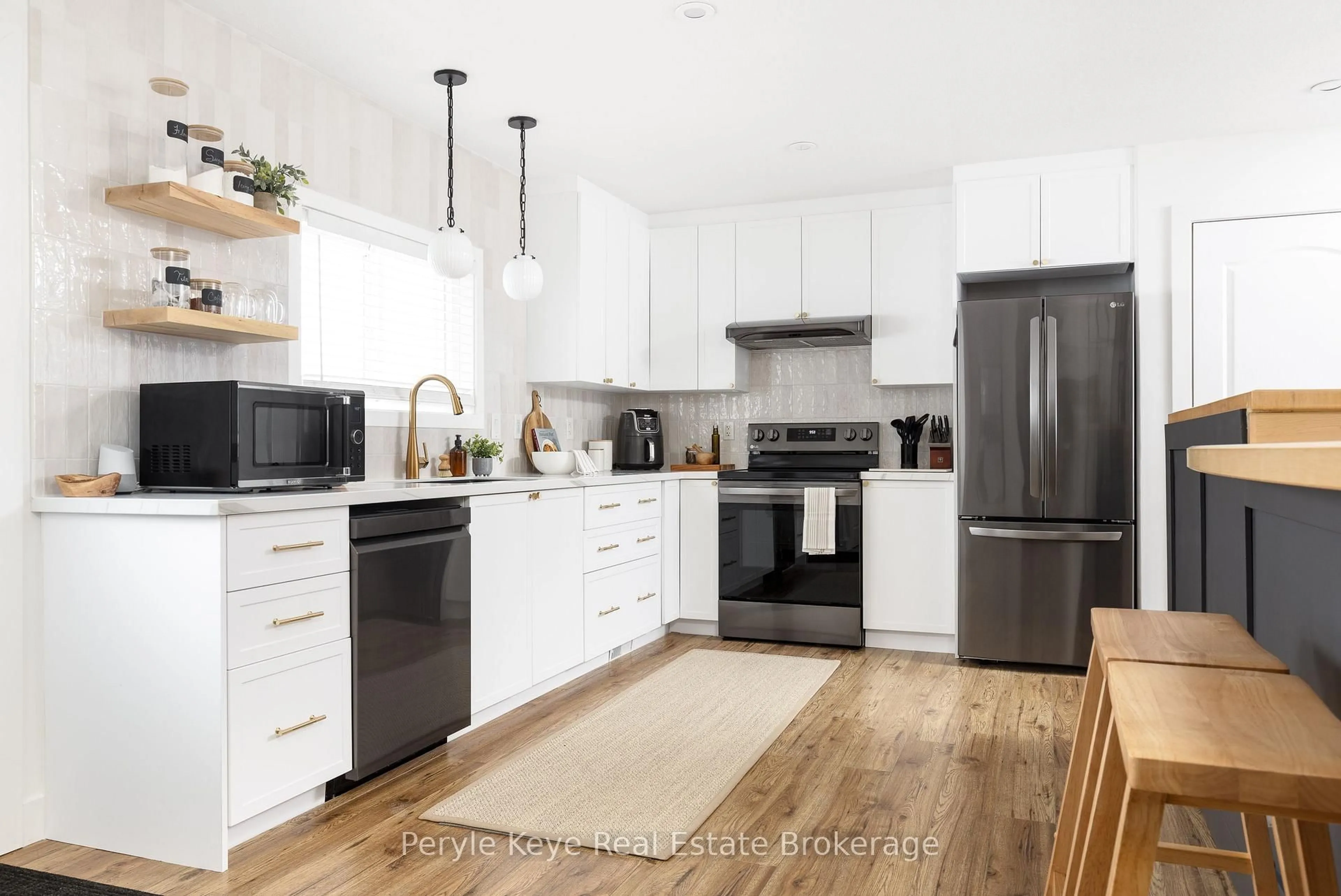 Open concept kitchen, wood/laminate floor for 84 James St, Burk's Falls Ontario P0A 1C0