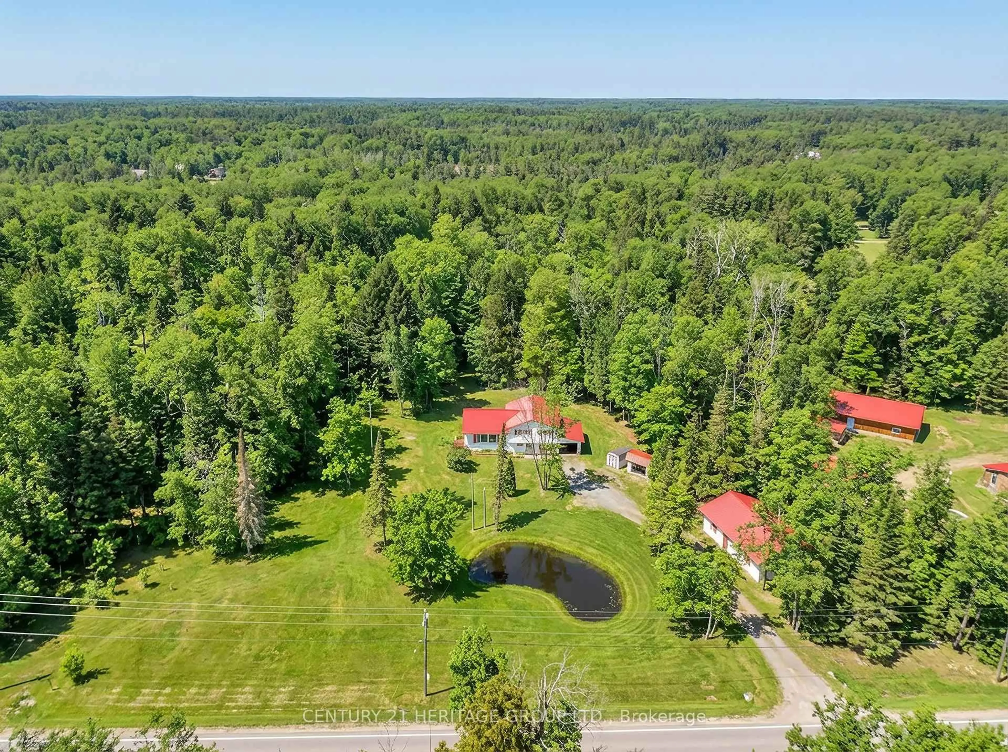 A pic from outside/outdoor area/front of a property/back of a property/a pic from drone, forest/trees view for 1715 Highway 118, Bracebridge Ontario P1L 1X1