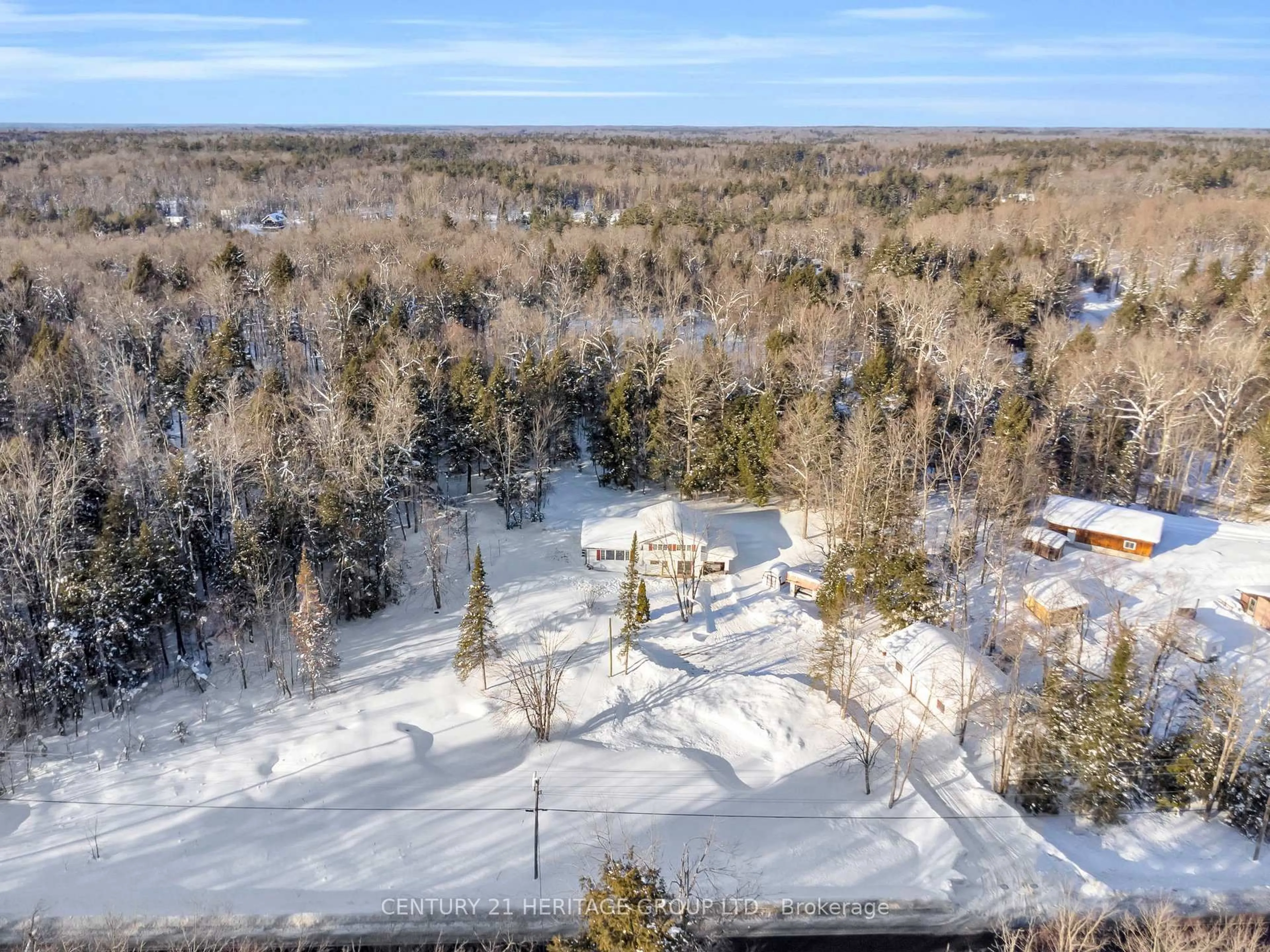 A pic from outside/outdoor area/front of a property/back of a property/a pic from drone, forest/trees view for 1715 Highway 118, Bracebridge Ontario P1L 1X1