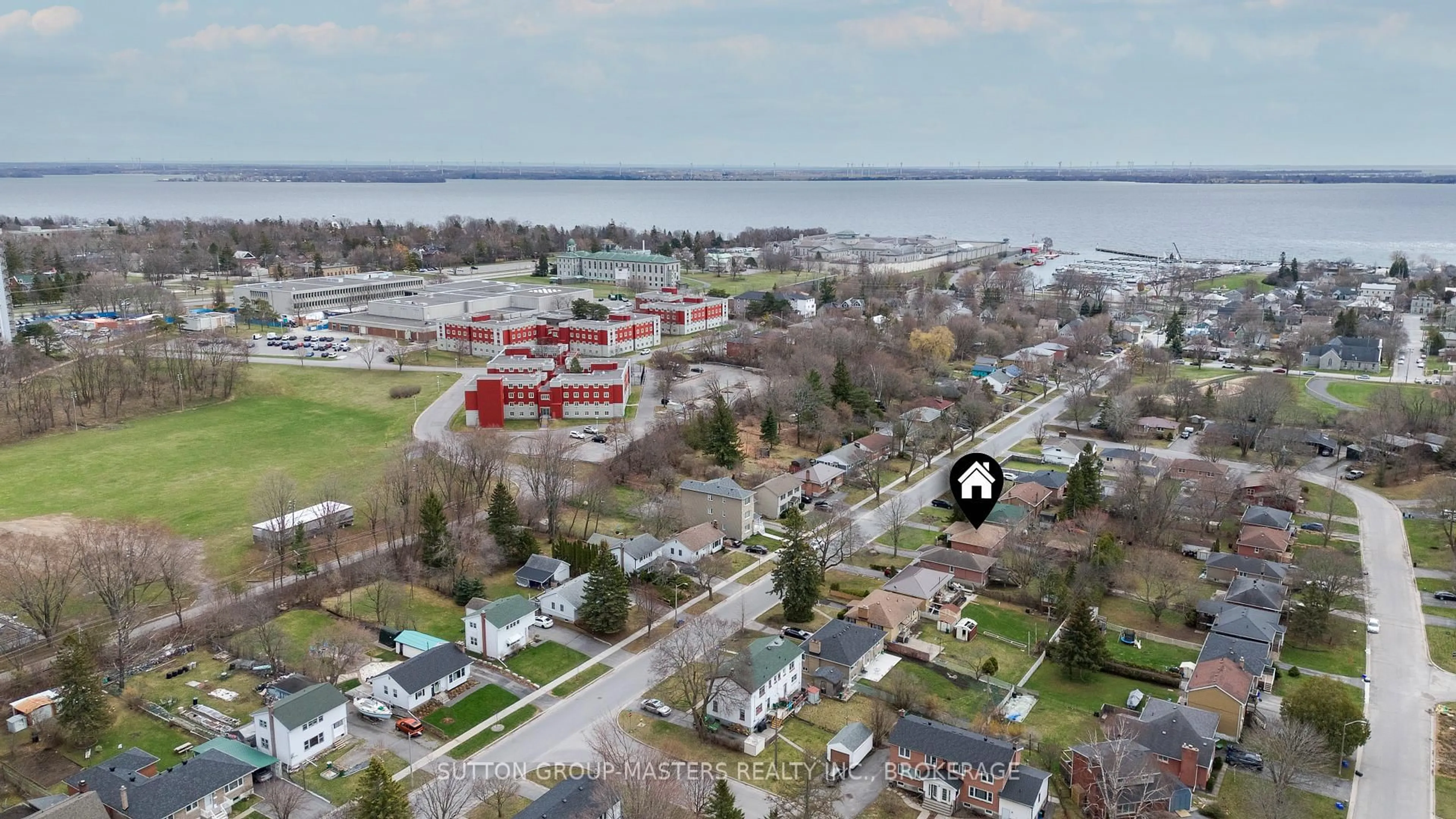 A pic from outside/outdoor area/front of a property/back of a property/a pic from drone, water/lake/river/ocean view for 250 Yonge St, Kingston Ontario K7M 1G5