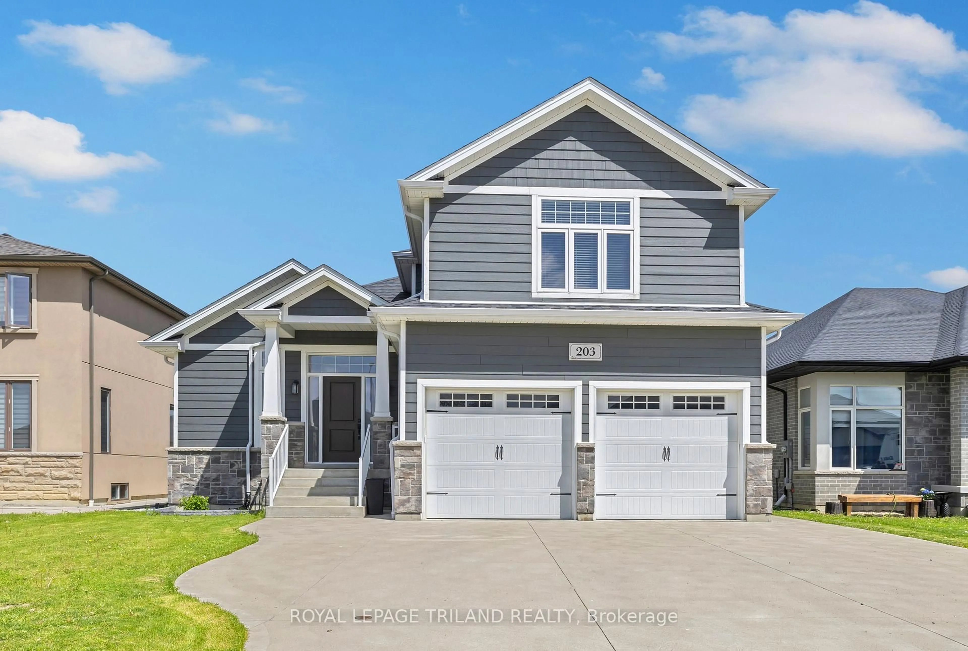 Home with vinyl exterior material, street for 203 Spring St, Windsor Ontario N0R 1A0