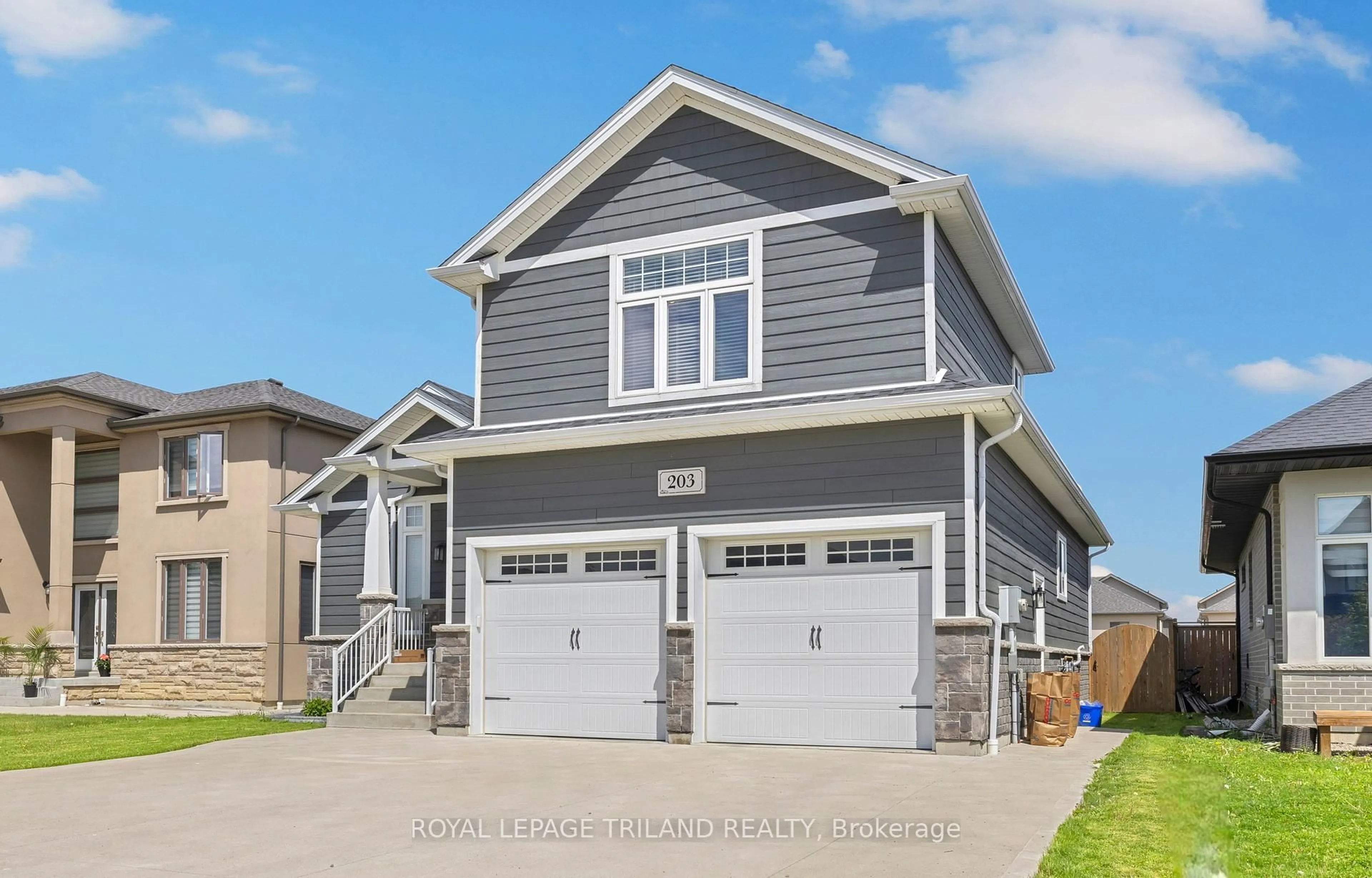 Home with vinyl exterior material, street for 203 Spring St, Windsor Ontario N0R 1A0