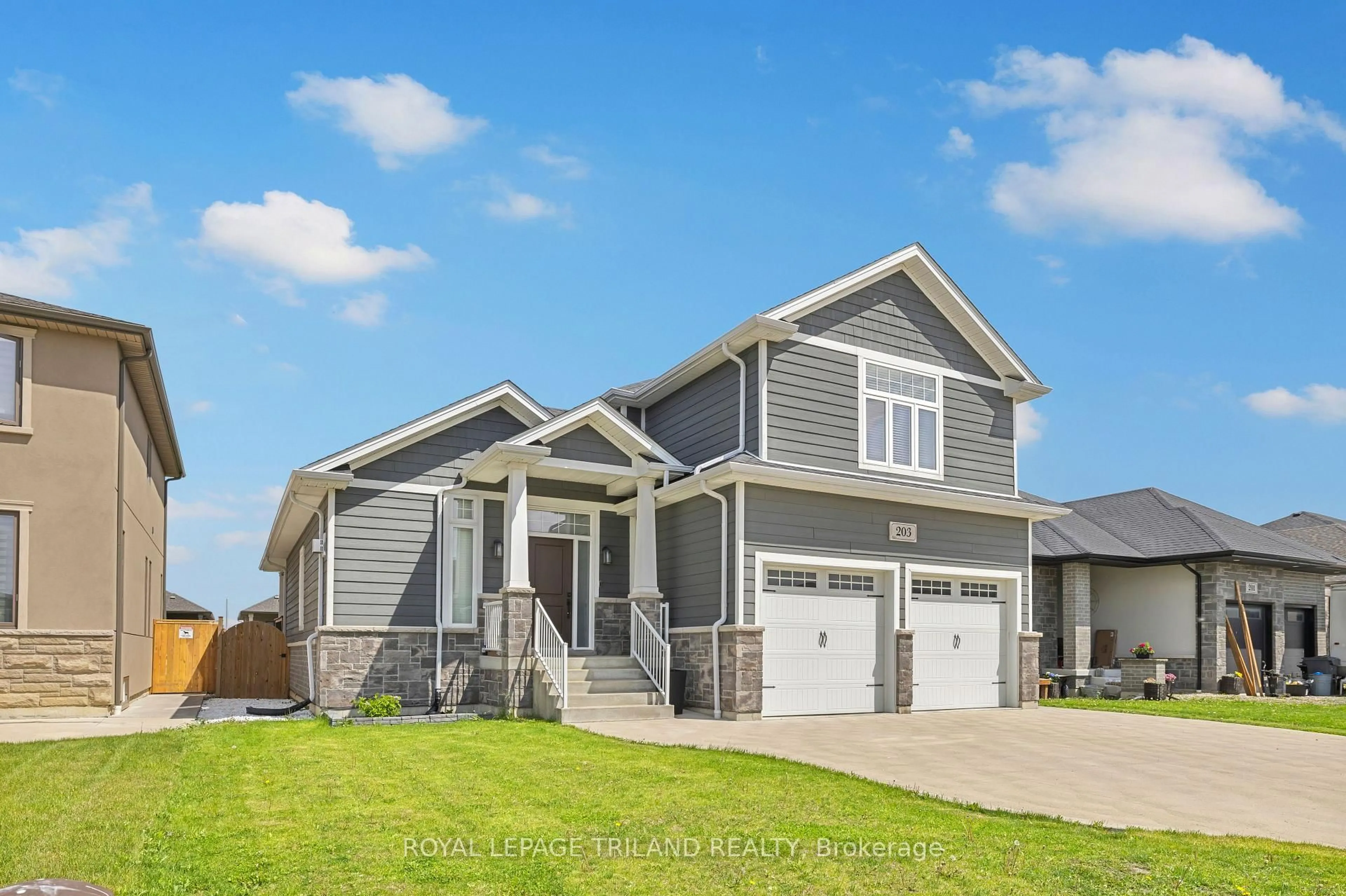 Home with vinyl exterior material, street for 203 Spring St, Windsor Ontario N0R 1A0