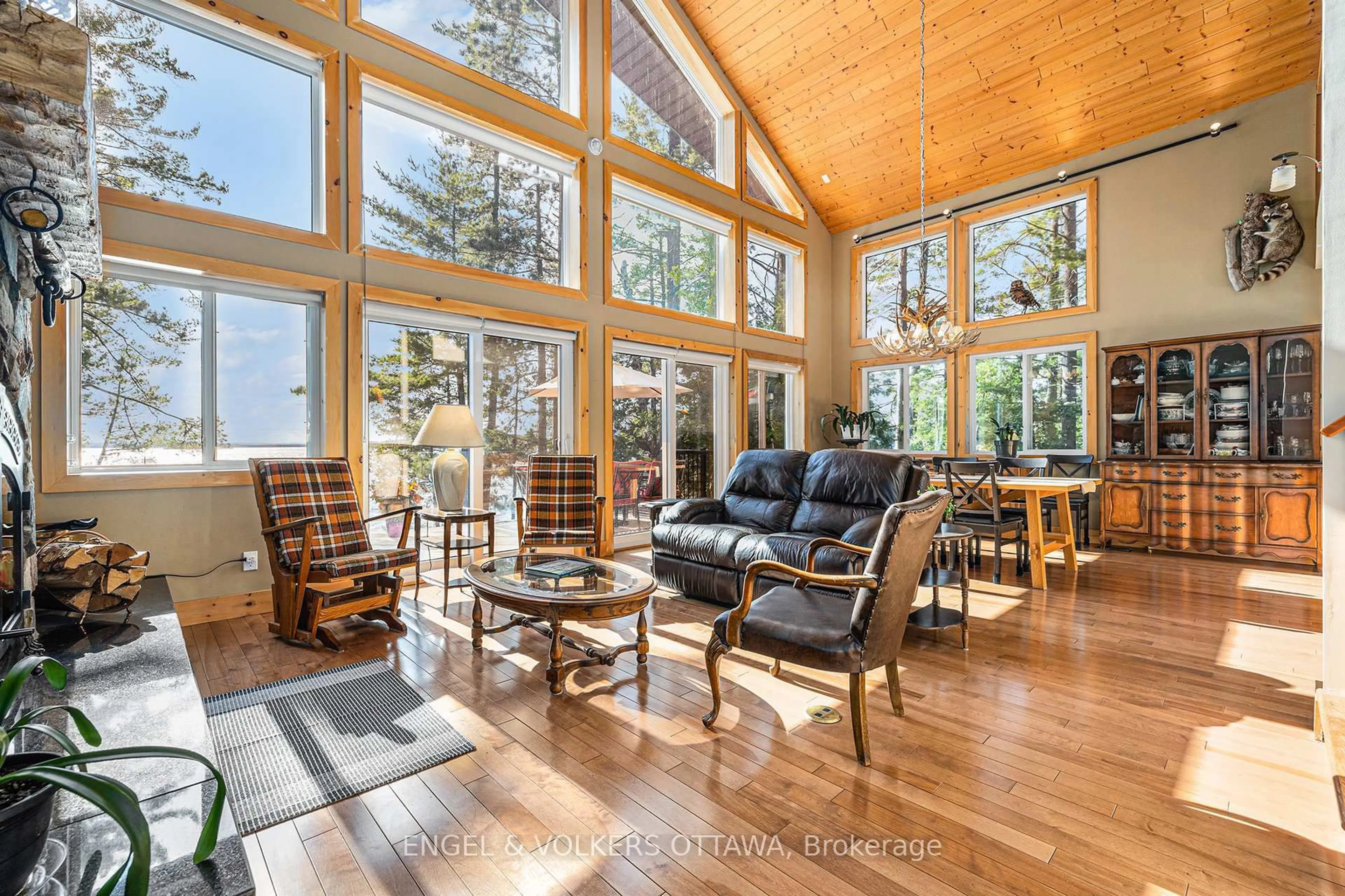 Living room with furniture, wood/laminate floor for 631 Golden Lyn Way, Golden Lake Ontario K0J 1X0