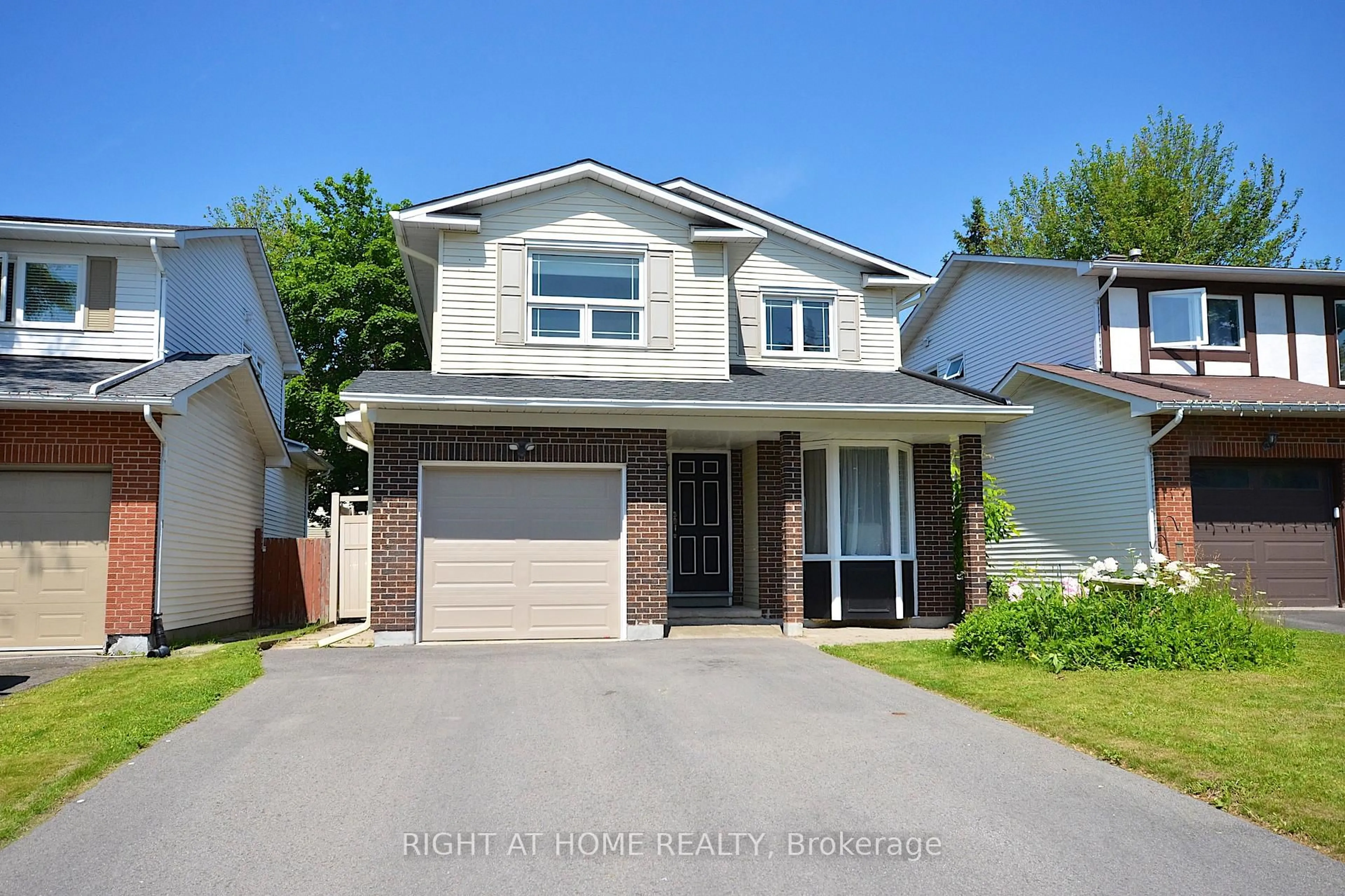 Home with vinyl exterior material, street for 77 Winchester Dr, Ottawa Ontario K2L 2R3