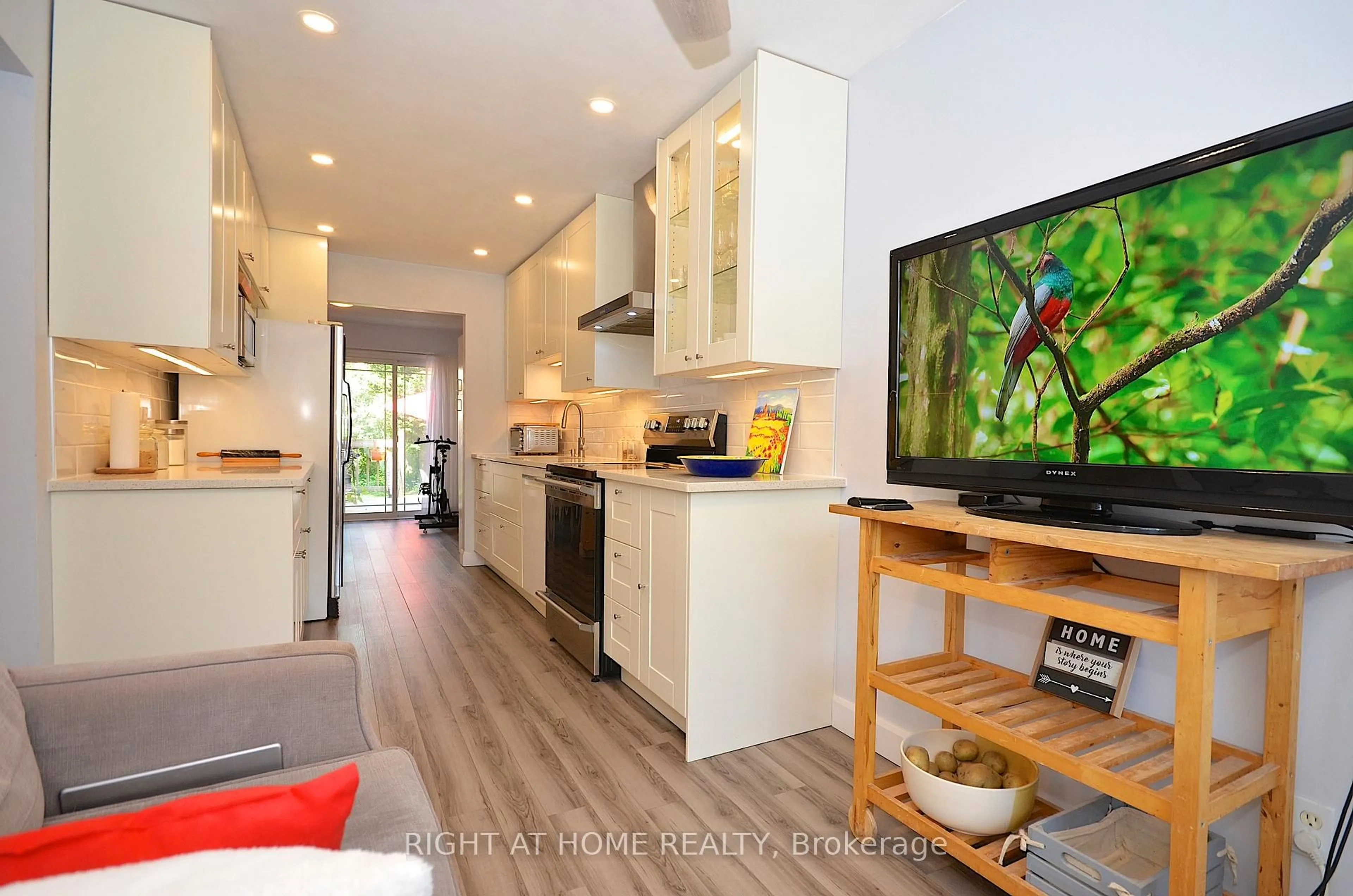 Open concept kitchen, wood/laminate floor for 77 Winchester Dr, Ottawa Ontario K2L 2R3