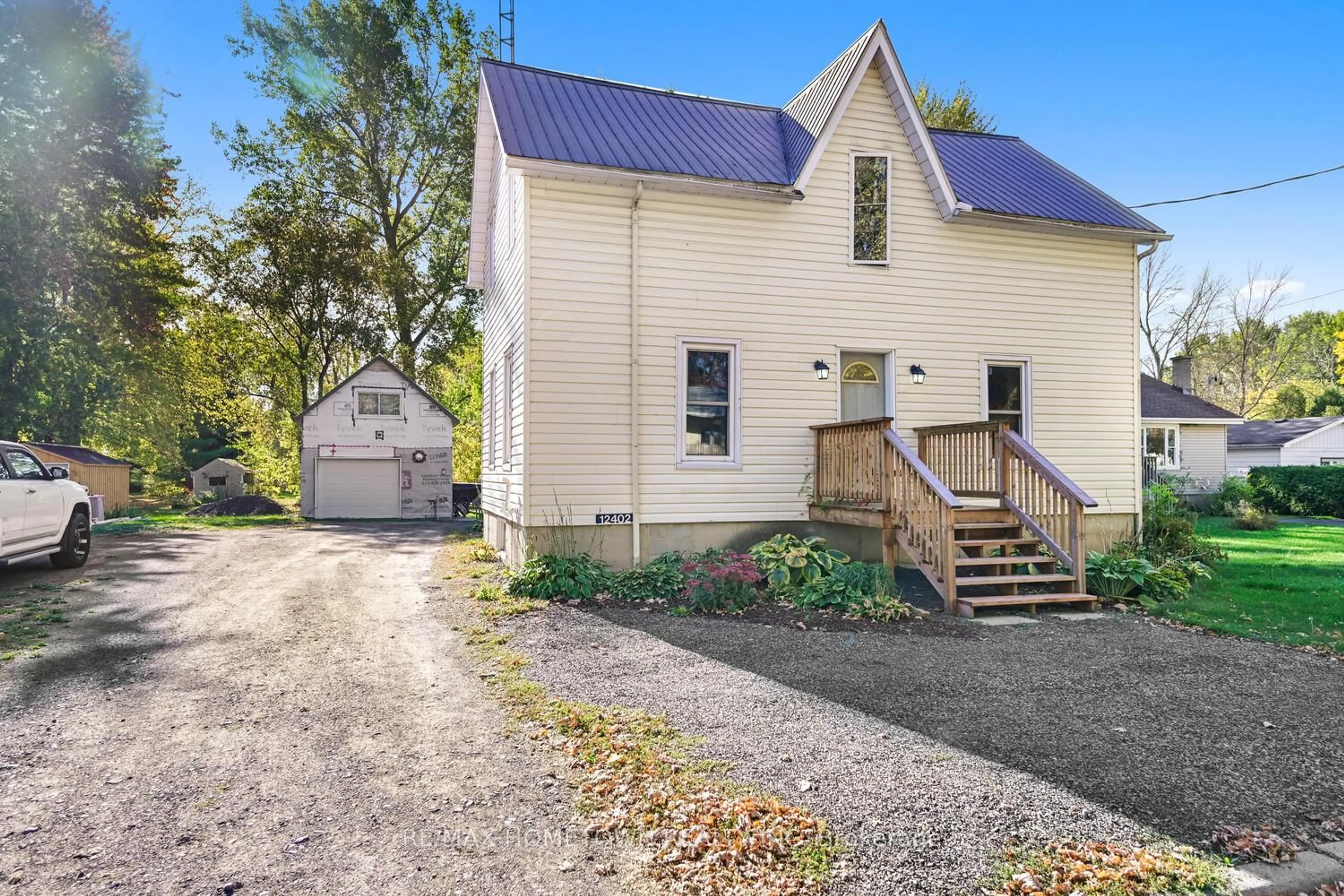 A pic from outside/outdoor area/front of a property/back of a property/a pic from drone, street for 12402 County Road 18 Rd, South Dundas Ontario K0C 2H0