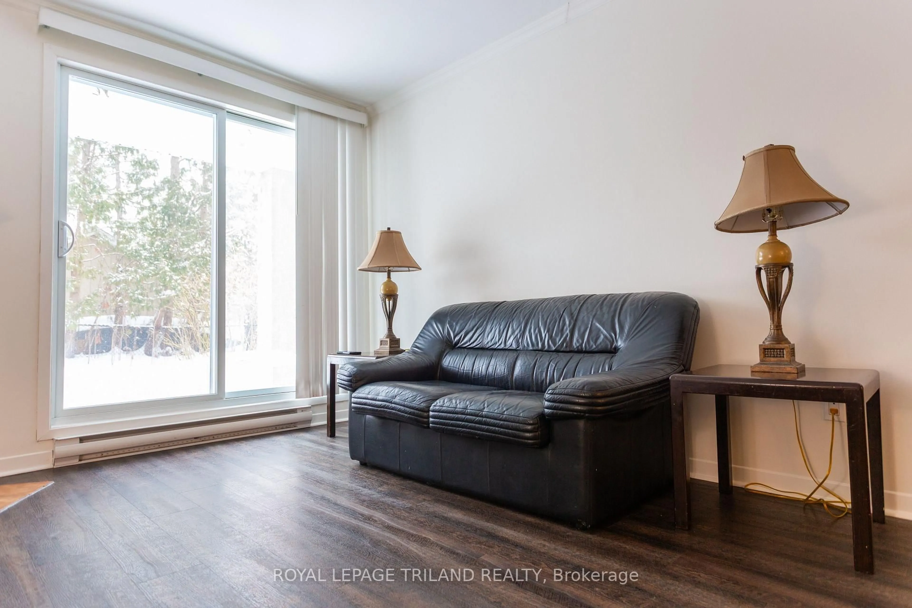 Living room with furniture, wood/laminate floor for 1096 Jalna Blvd #6, London South Ontario N6E 3B8