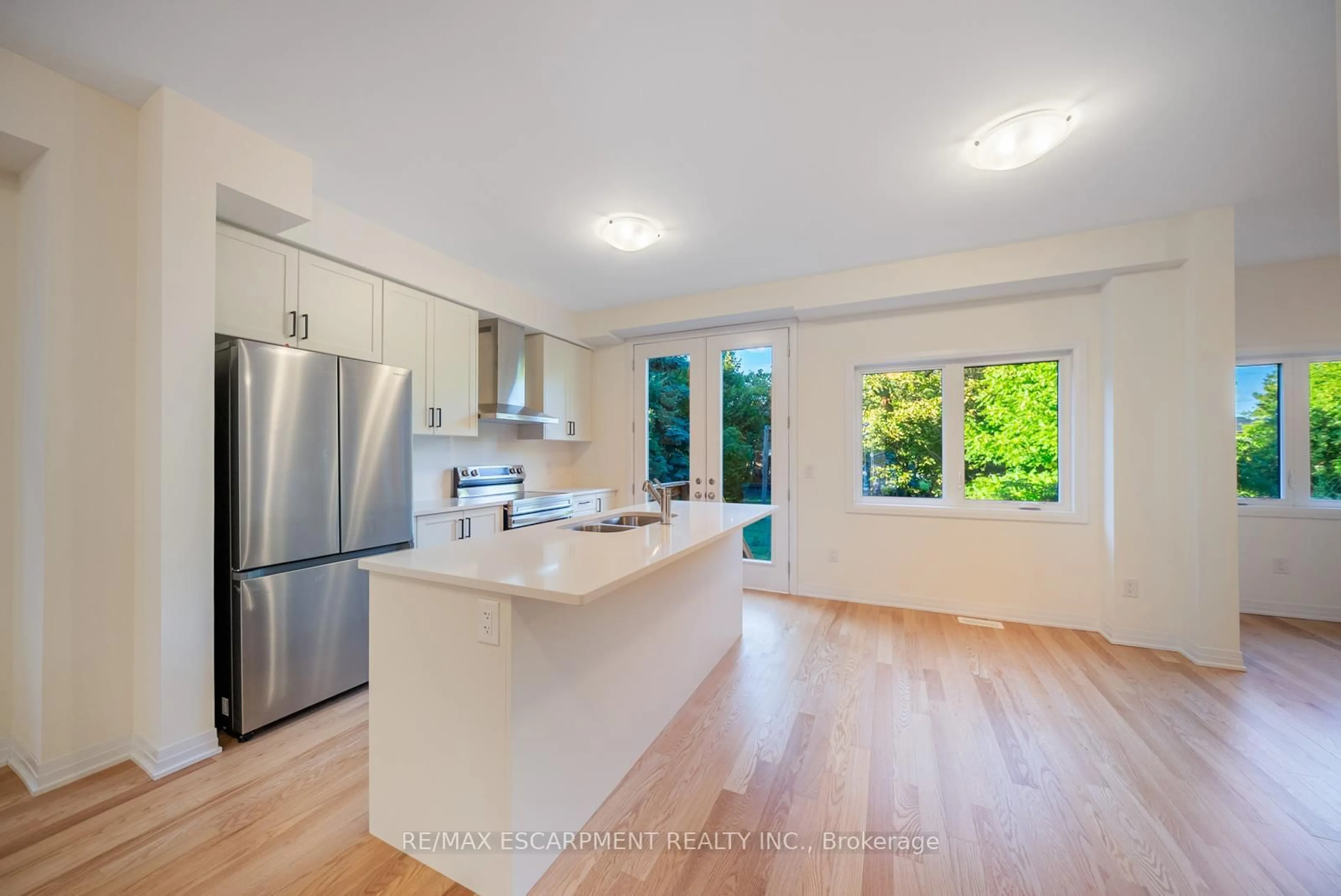 Open concept kitchen, wood/laminate floor for 461 Adelaide St, Wellington North Ontario N0G 1A0