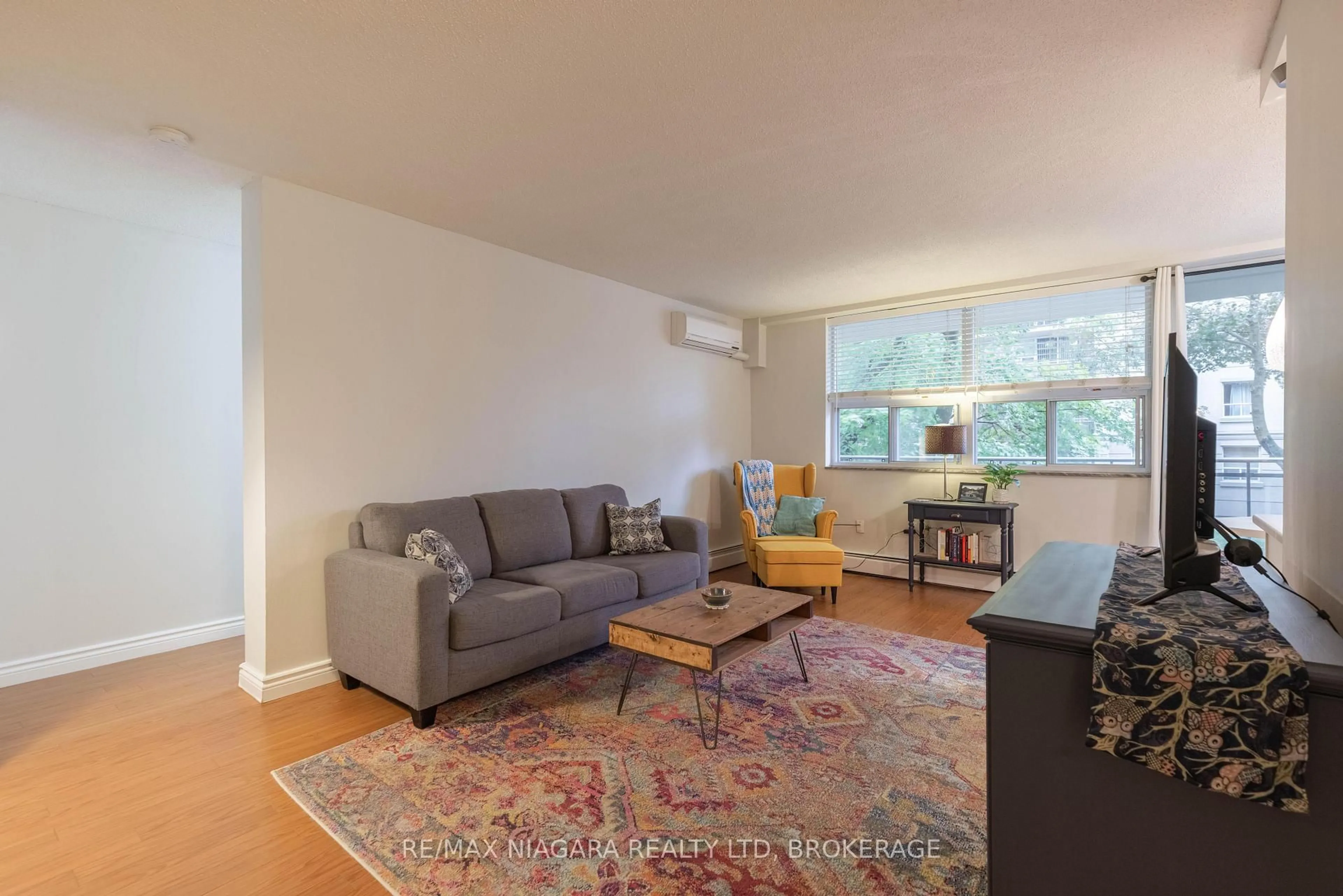 Living room with furniture, unknown for 6390 Huggins St #209, Niagara Falls Ontario L2J 1H1