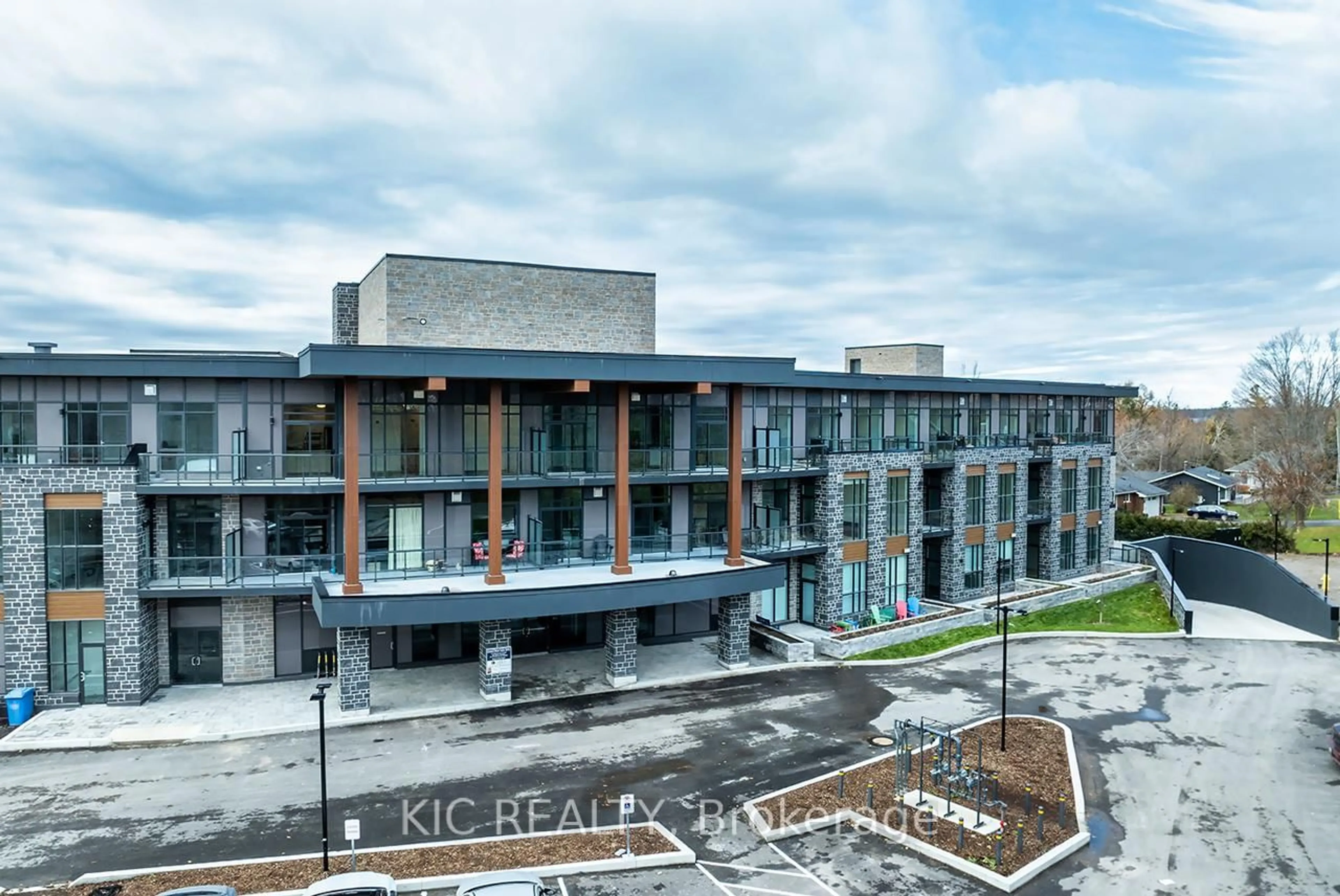 A pic from outside/outdoor area/front of a property/back of a property/a pic from drone, building for 99 Louisa St #307, Kawartha Lakes Ontario K0M 1N0