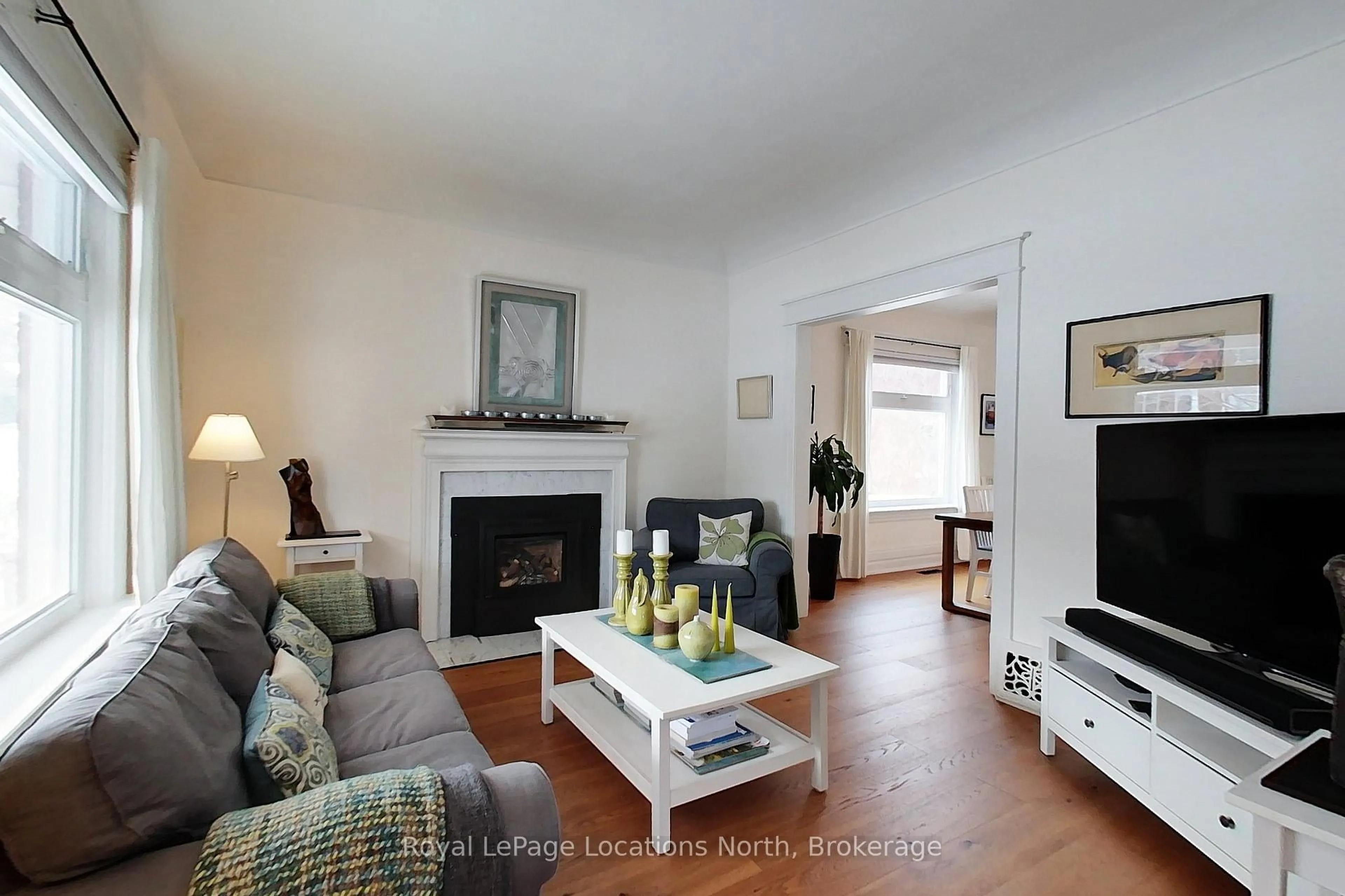 Living room with furniture, wood/laminate floor for 76 Trowbridge St, Meaford Ontario N4L 1G3