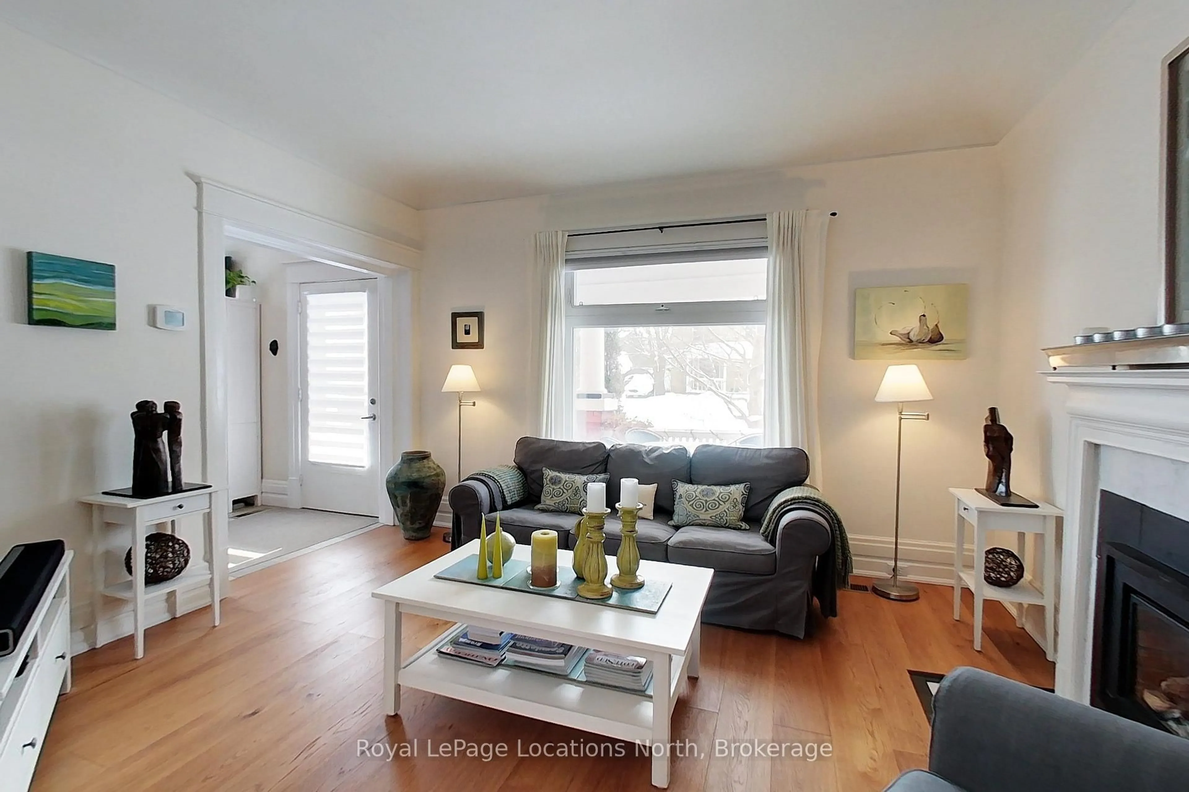 Living room with furniture, wood/laminate floor for 76 Trowbridge St, Meaford Ontario N4L 1G3