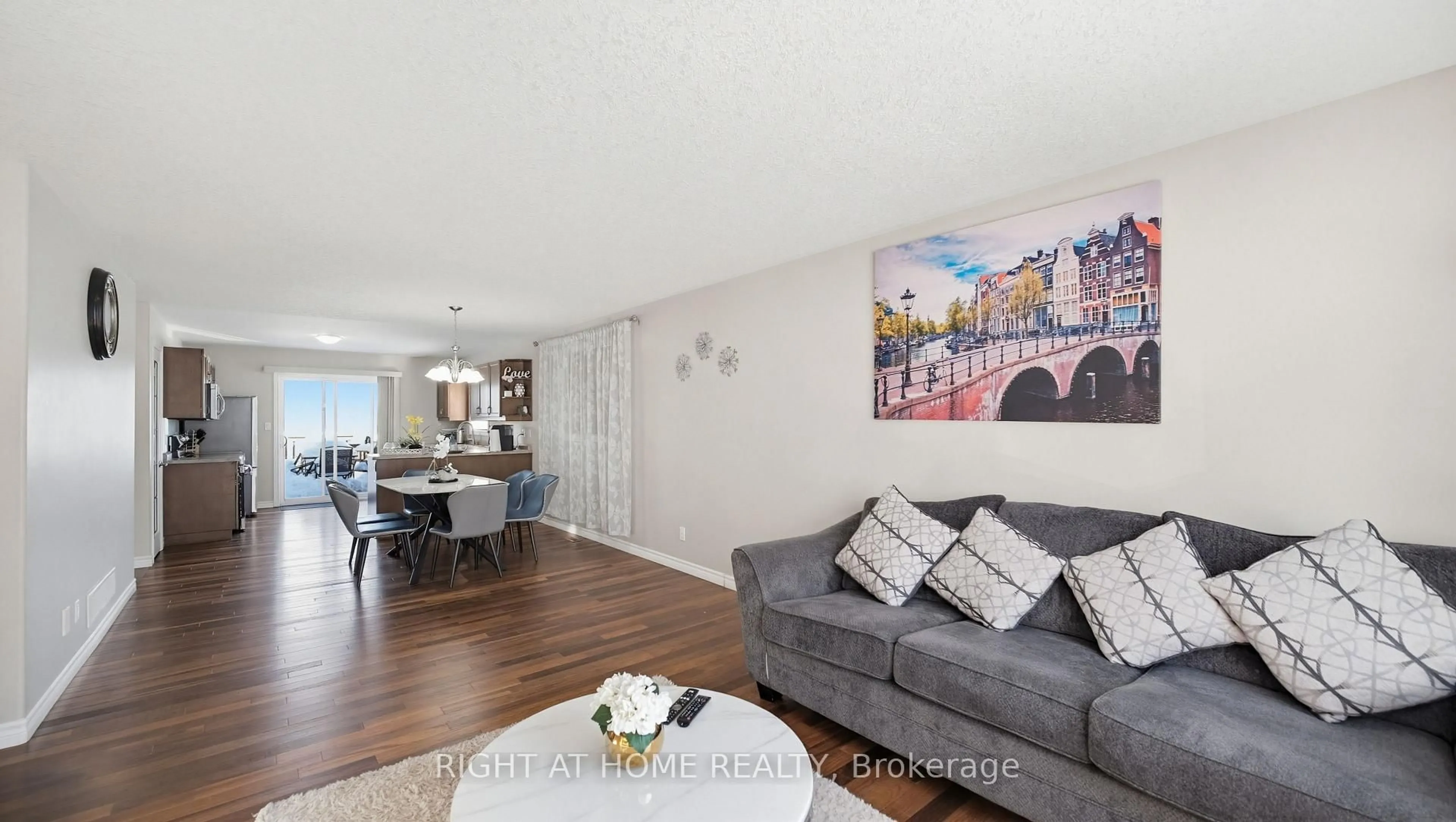 Living room with furniture, wood/laminate floor for 73 Frank St, Belleville Ontario K8P 3V5