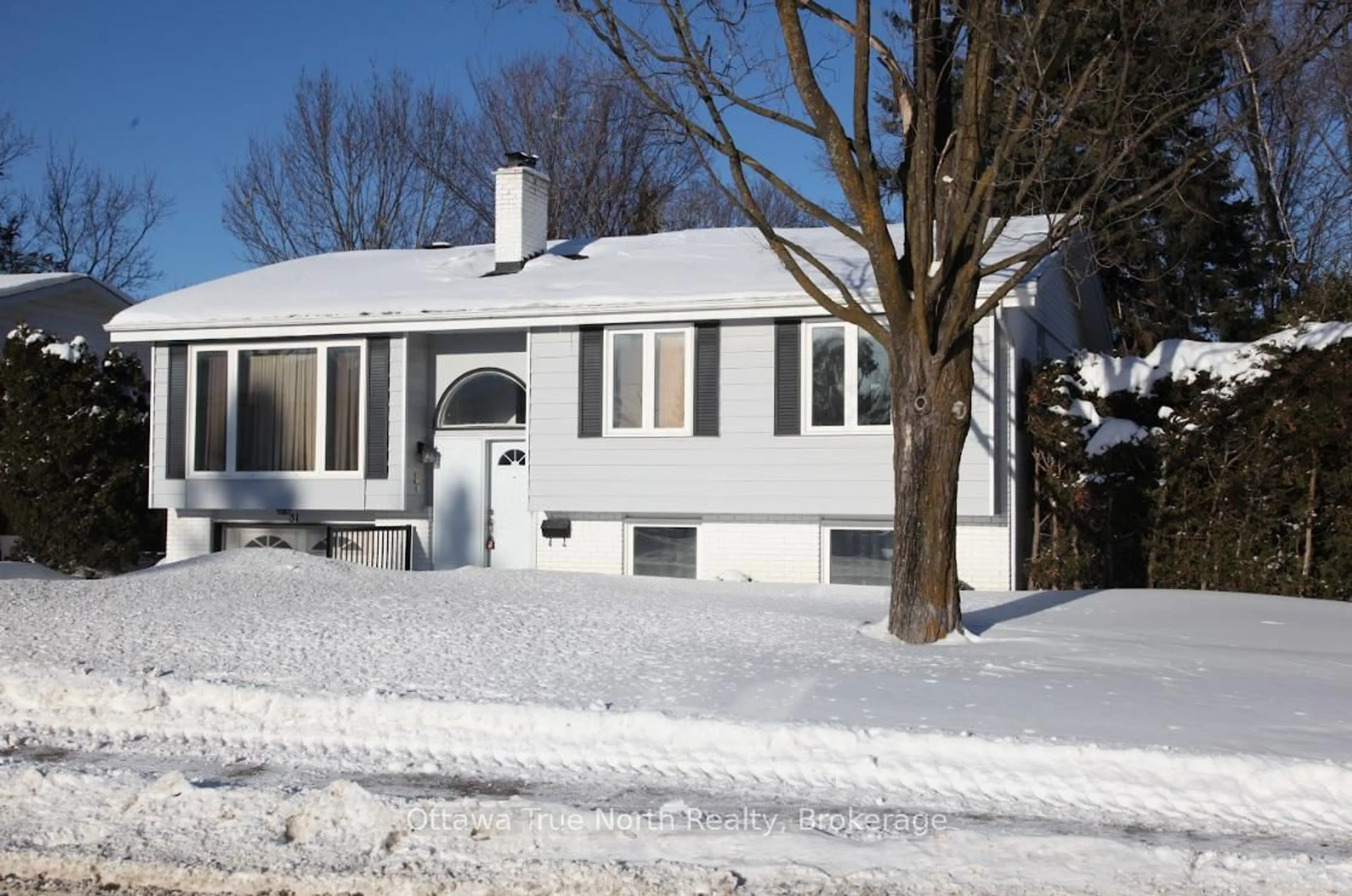 Home with vinyl exterior material, street for 31 Ashgrove Cres, Ottawa Ontario K2G 0S1