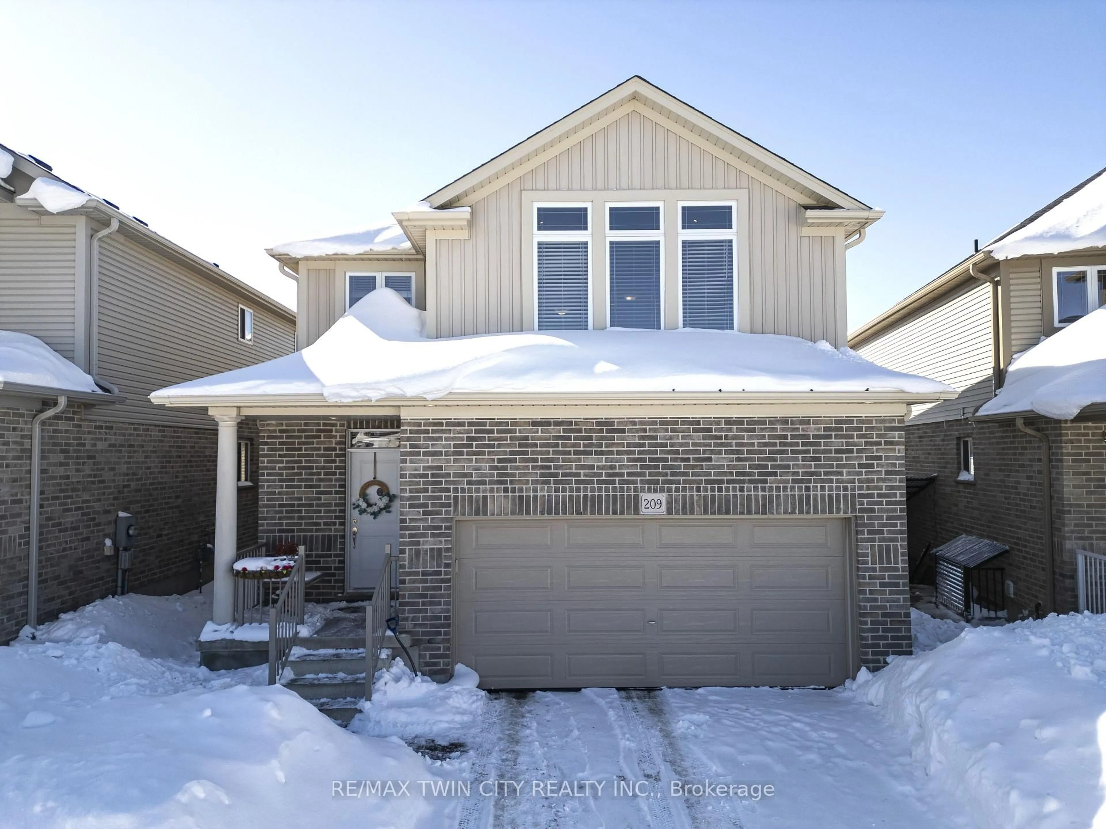 Home with brick exterior material, street for 209 Ladyslipper Dr, Waterloo Ontario N2V 0C3