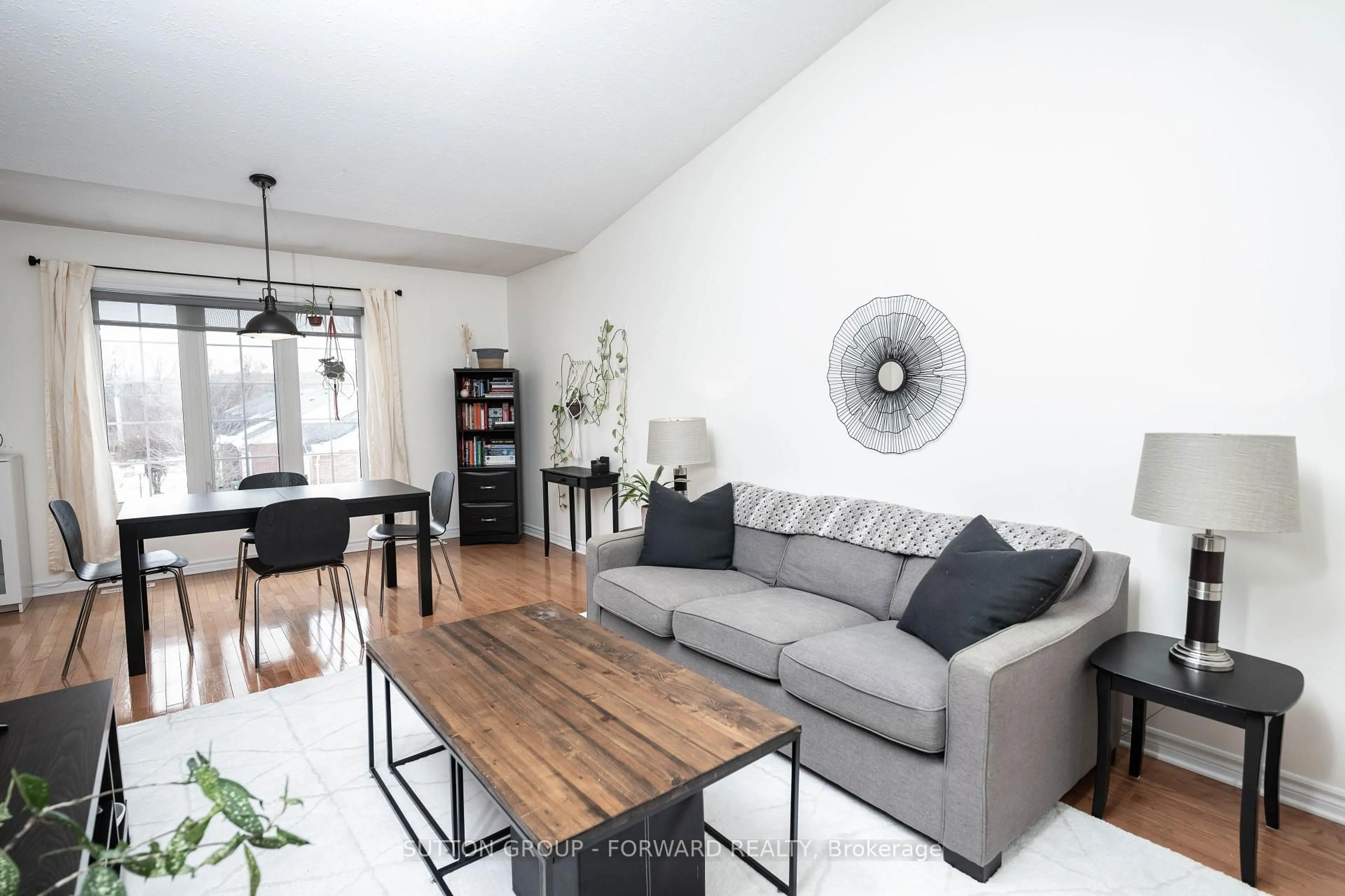 Living room with furniture, wood/laminate floor for 1077 Hamilton Rd #9, London East Ontario N5W 6G3