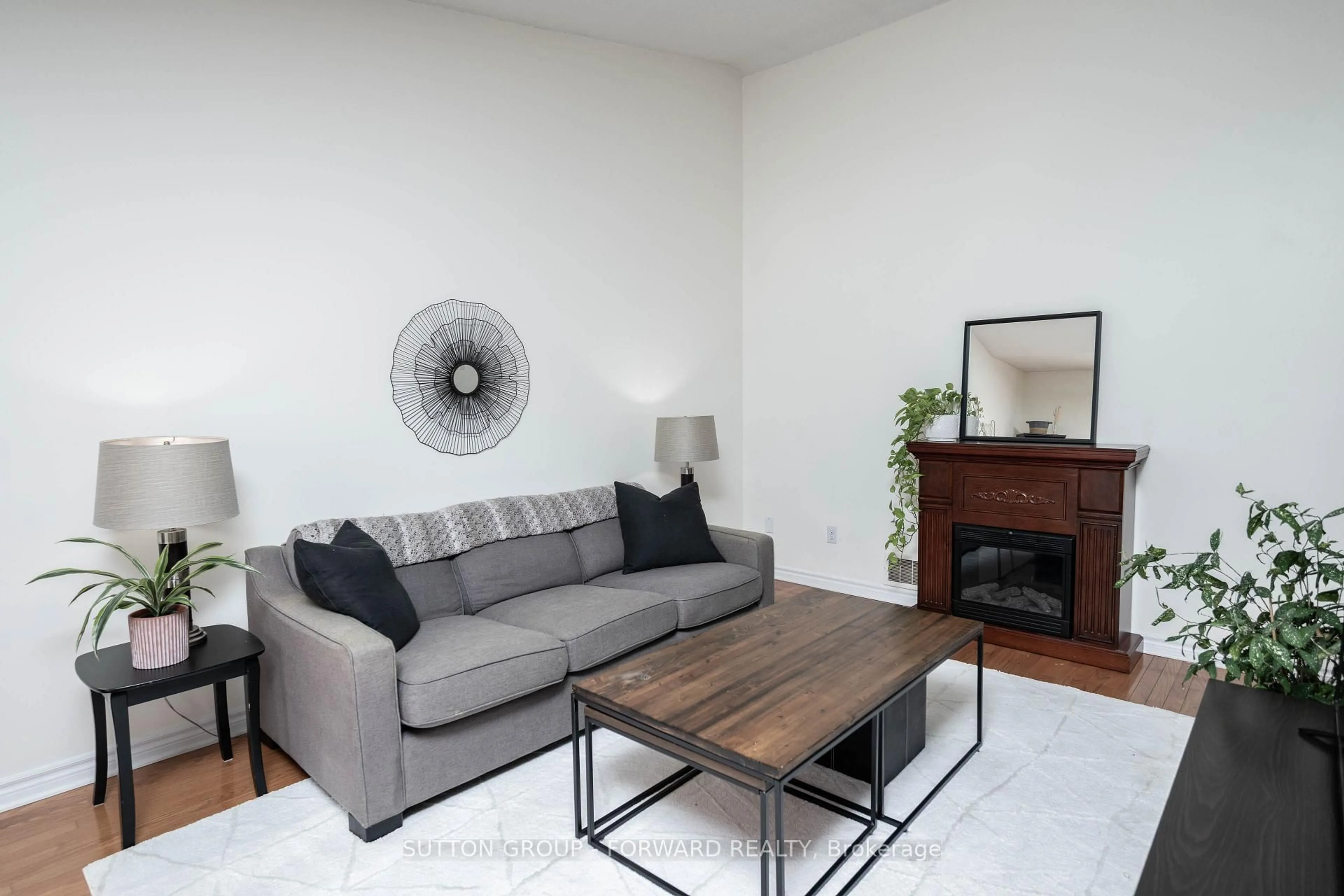 Living room with furniture, wood/laminate floor for 1077 Hamilton Rd #9, London East Ontario N5W 6G3