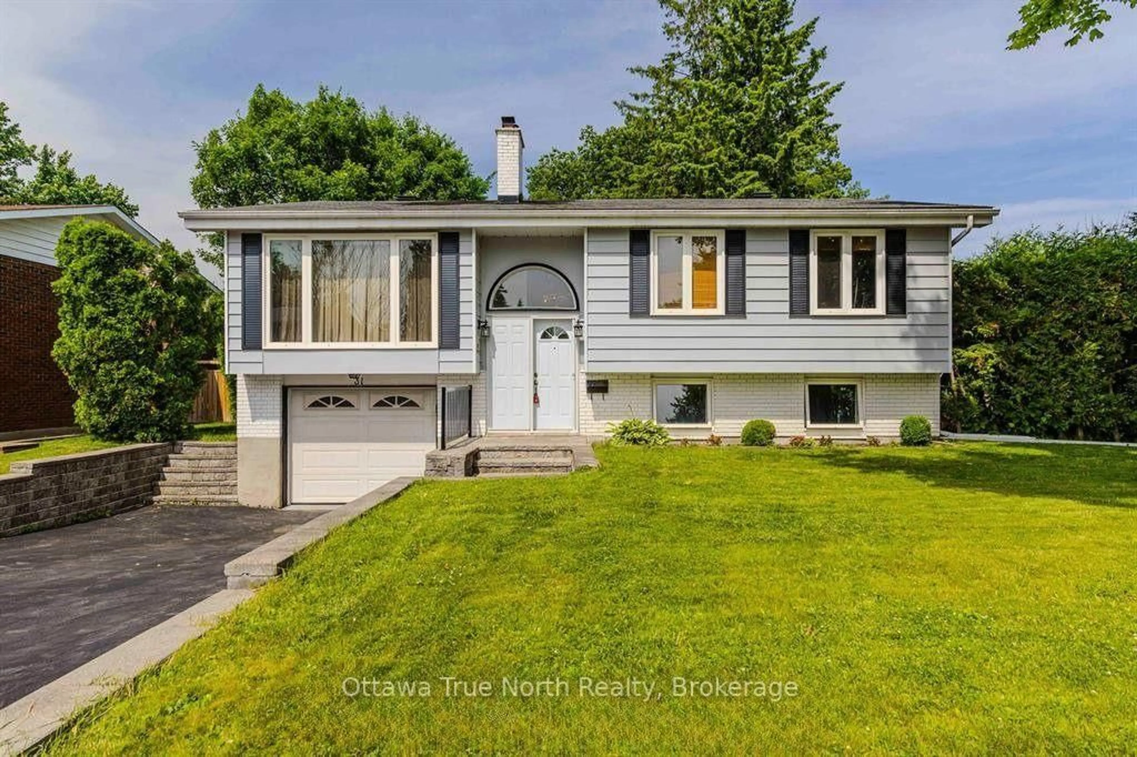Home with vinyl exterior material, street for 31 Ashgrove Cres, Ottawa Ontario K2G 0S1