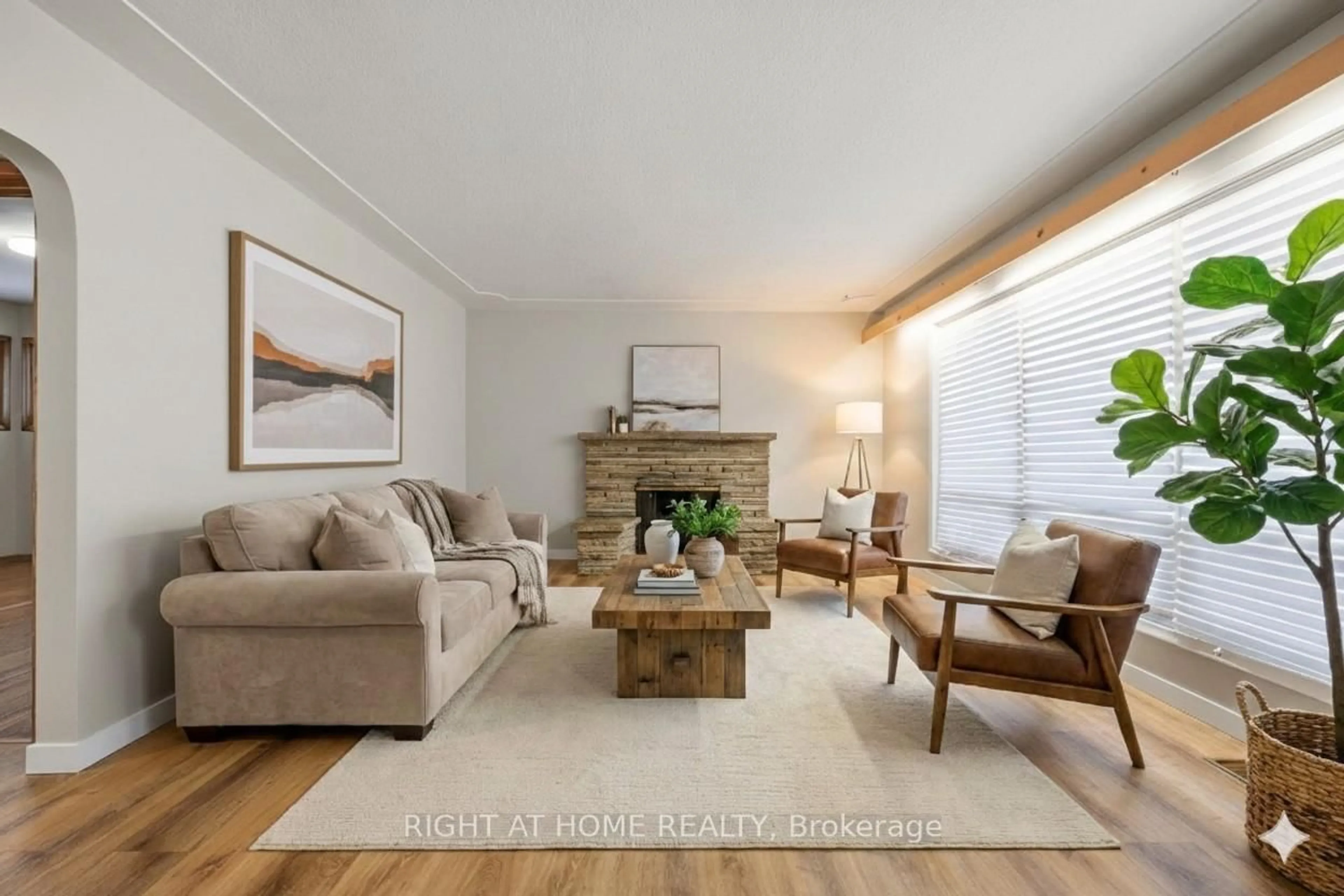 Living room with furniture, wood/laminate floor for 241 East St, Sarnia Ontario N7T 3R8