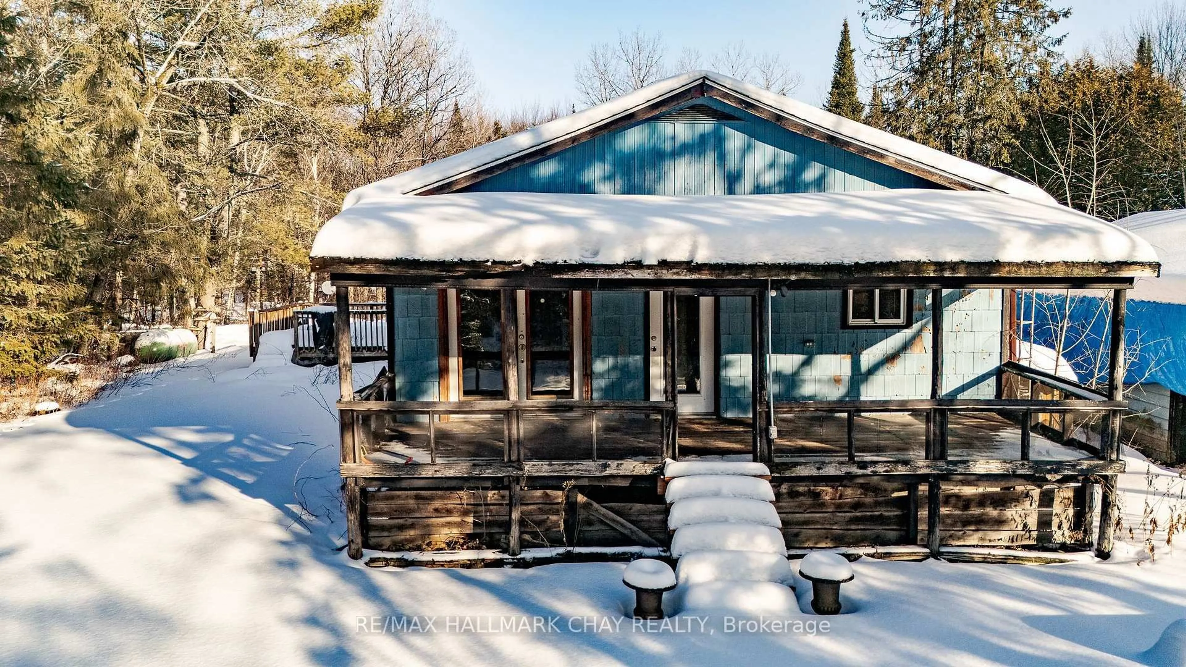 A pic from outside/outdoor area/front of a property/back of a property/a pic from drone, water/lake/river/ocean view for 24-30 Robert Rd, Huntsville Ontario P1H 2J4