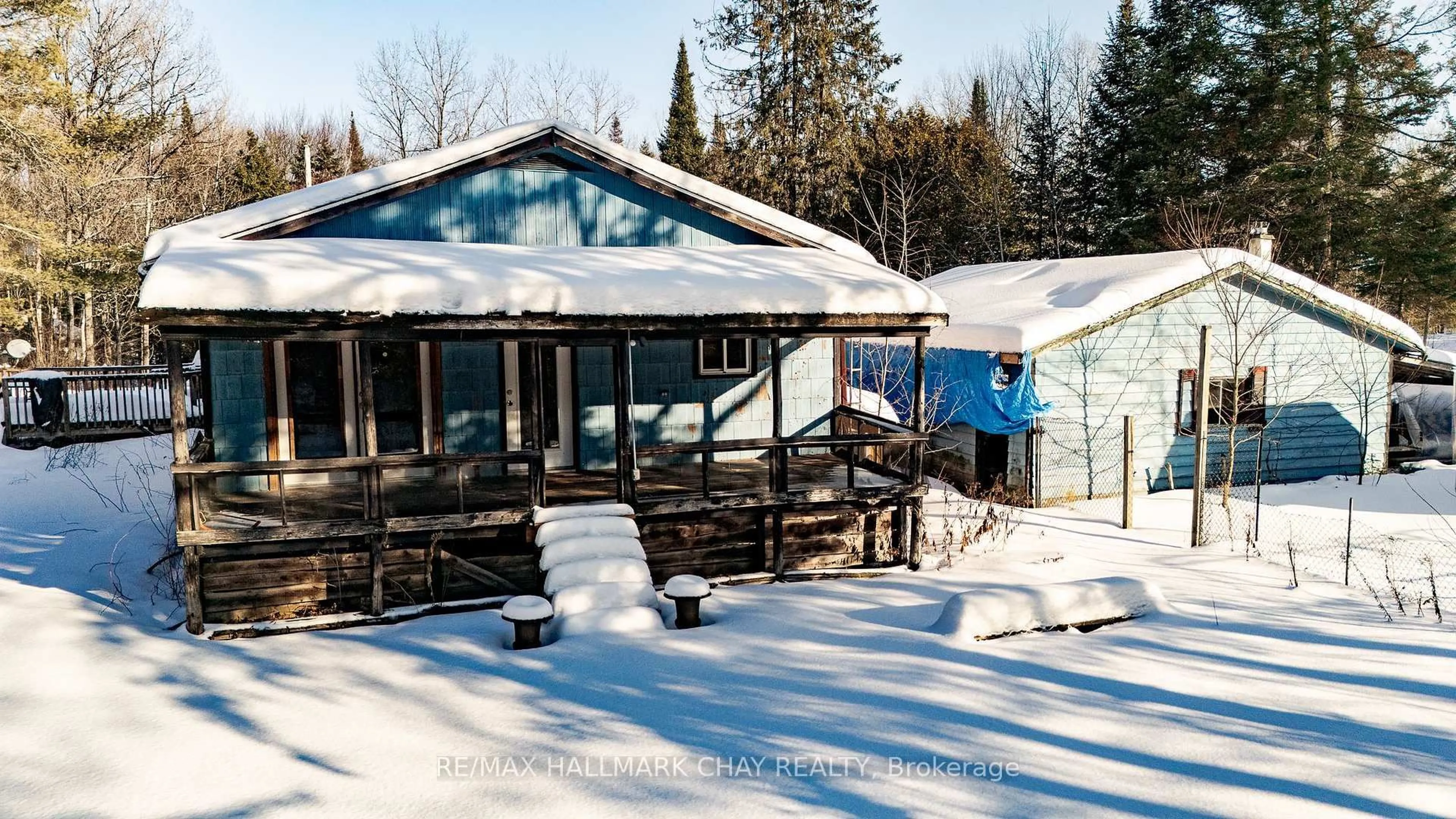 A pic from outside/outdoor area/front of a property/back of a property/a pic from drone, unknown for 24-30 Robert Rd, Huntsville Ontario P1H 2J4