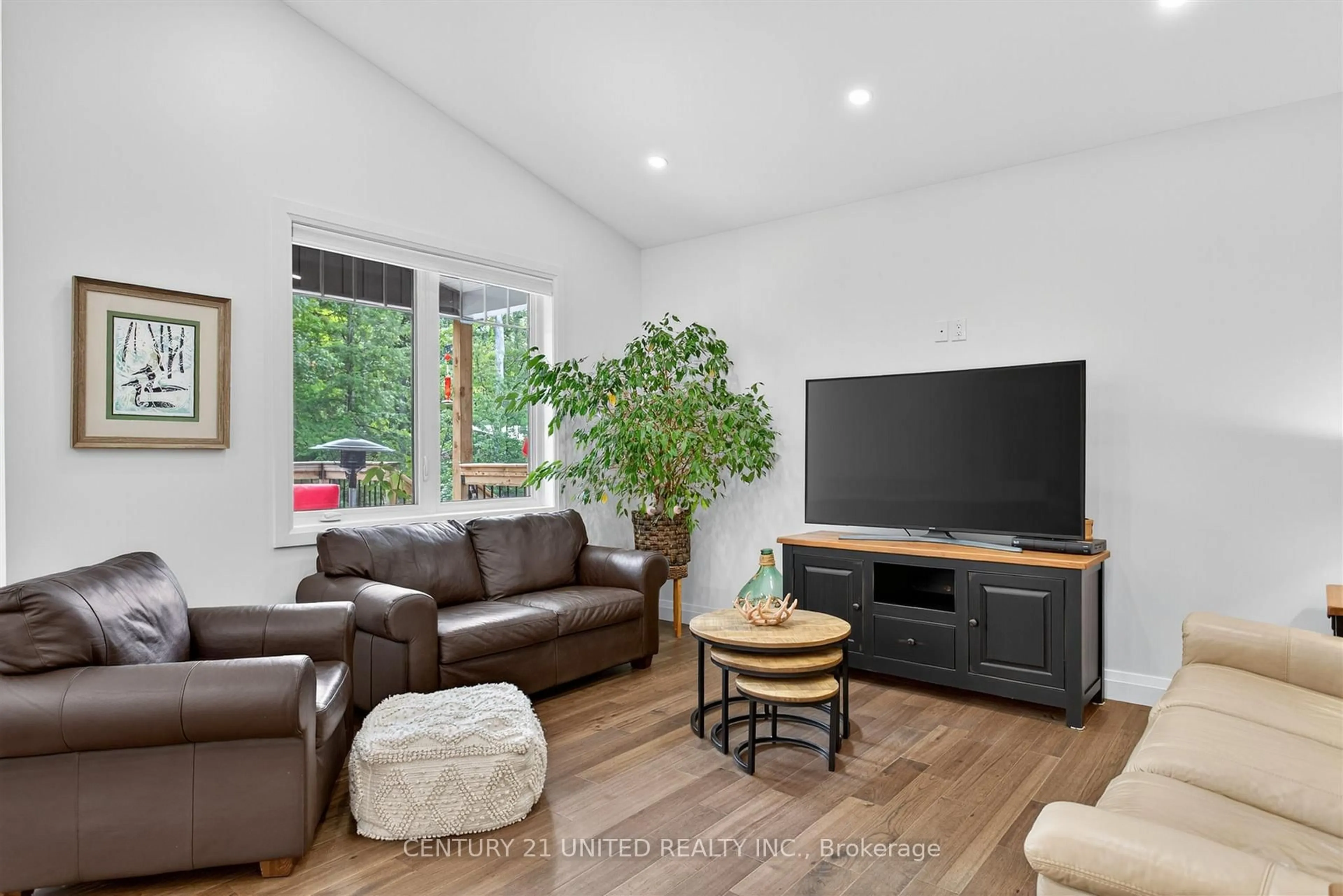 Living room with furniture, wood/laminate floor for 322 Elbow Point Rd, Trent Lakes Ontario K0L 1J0