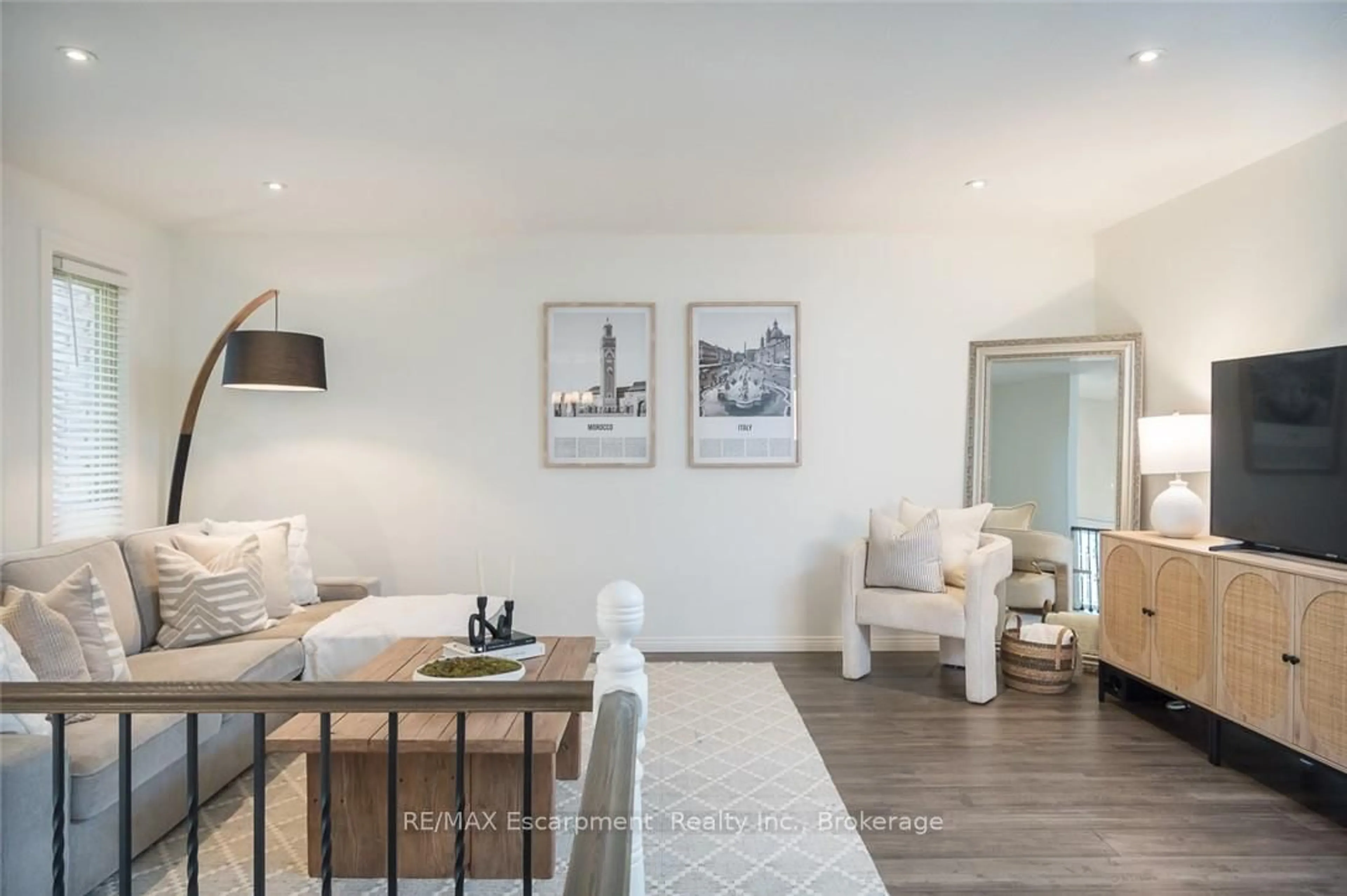 Living room with furniture, wood/laminate floor for 45 AMBERWOOD St, Hamilton Ontario L8J 1J1