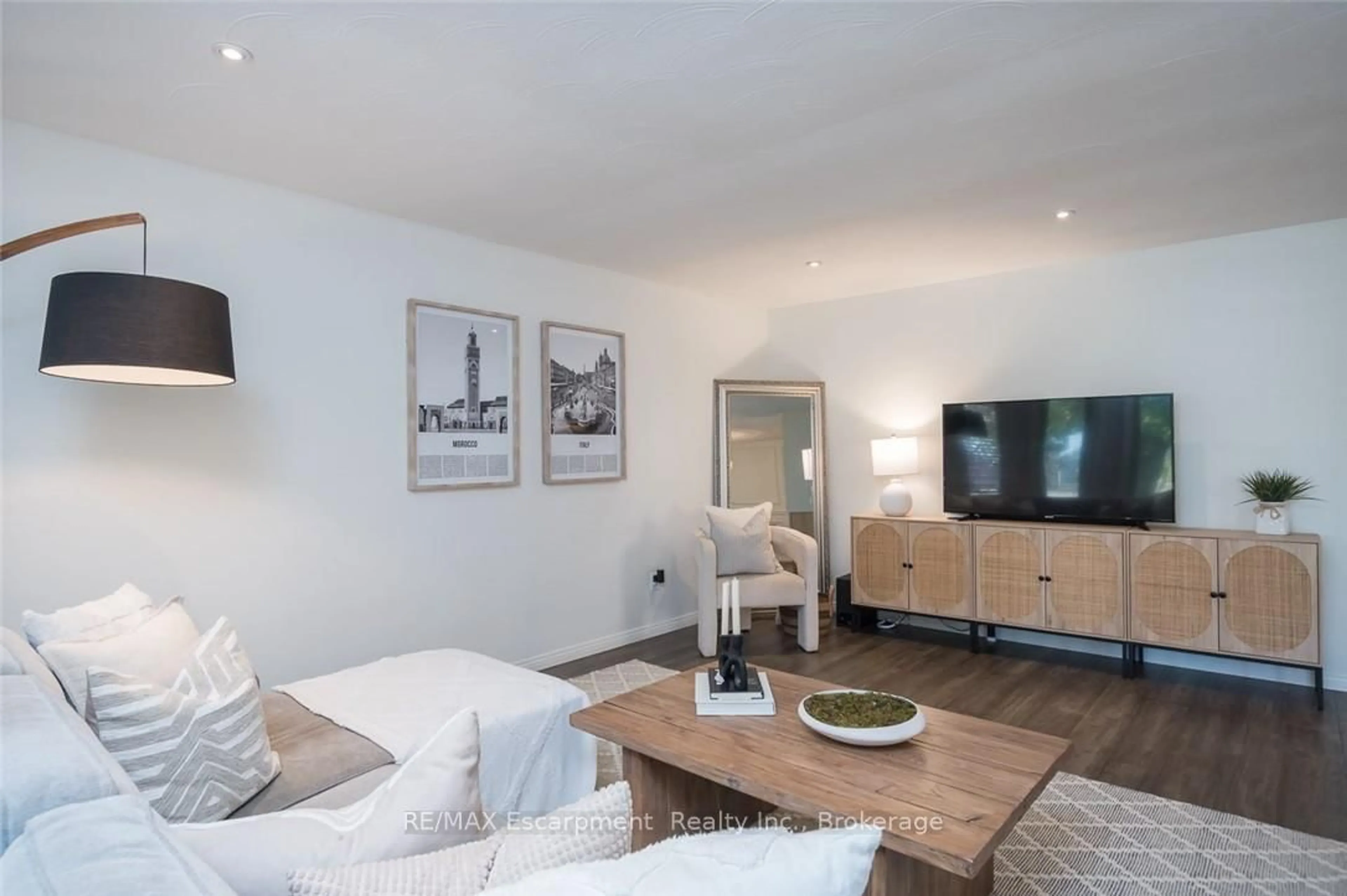 Living room with furniture, wood/laminate floor for 45 AMBERWOOD St, Hamilton Ontario L8J 1J1