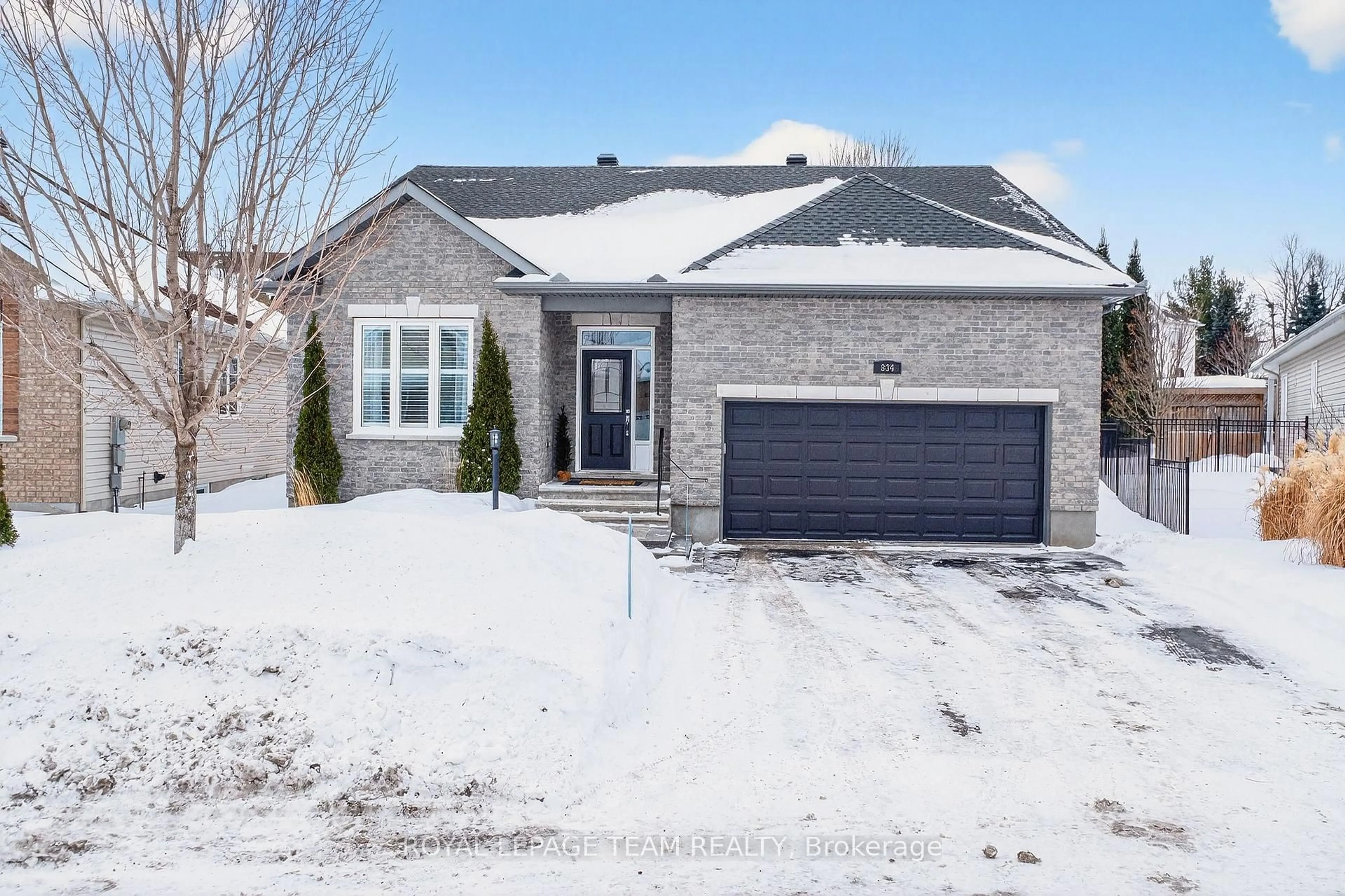 Home with brick exterior material, street for 834 Rockson Cres, Stittsville Ontario K2S 0S6