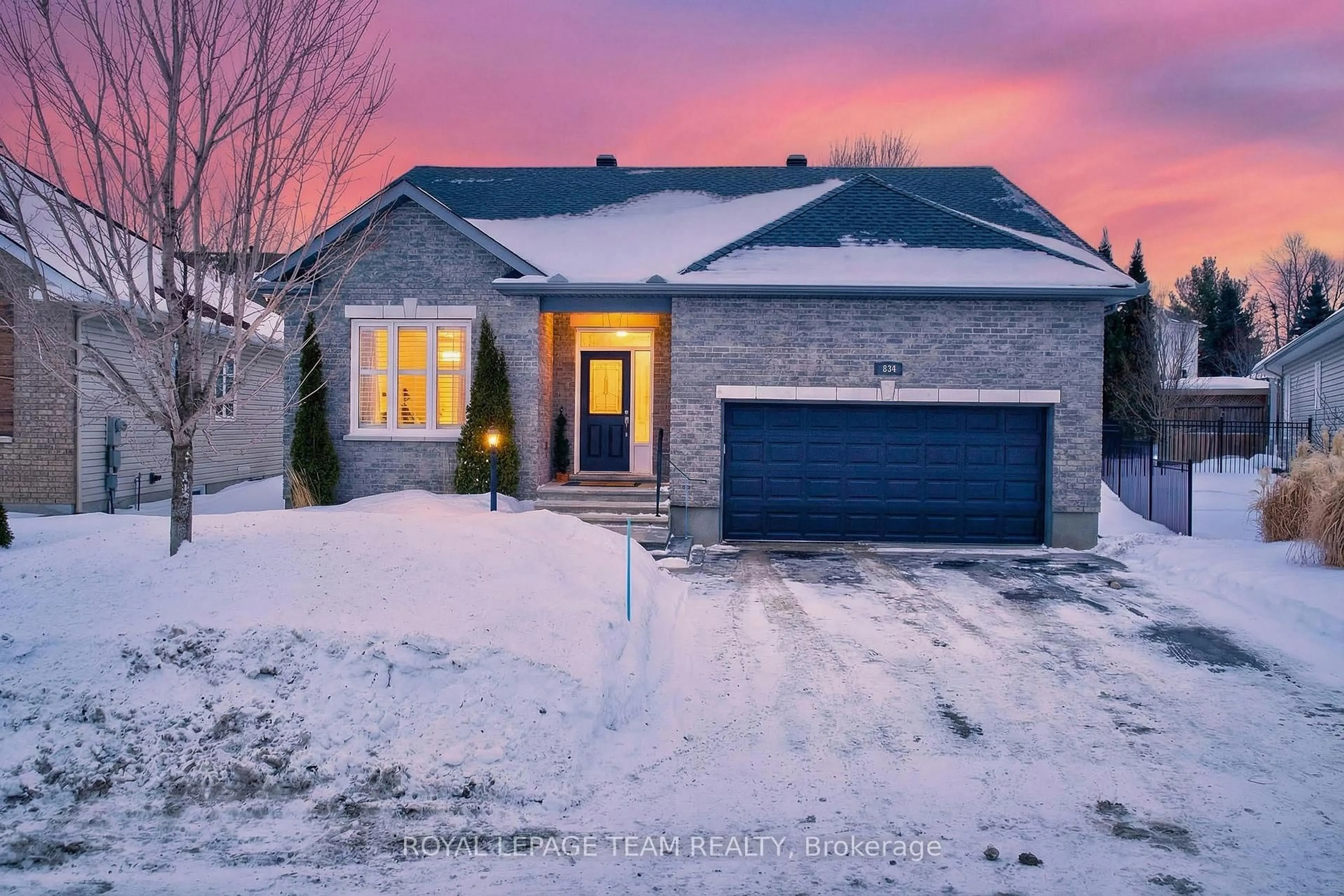 Home with brick exterior material, street for 834 Rockson Cres, Stittsville Ontario K2S 0S6