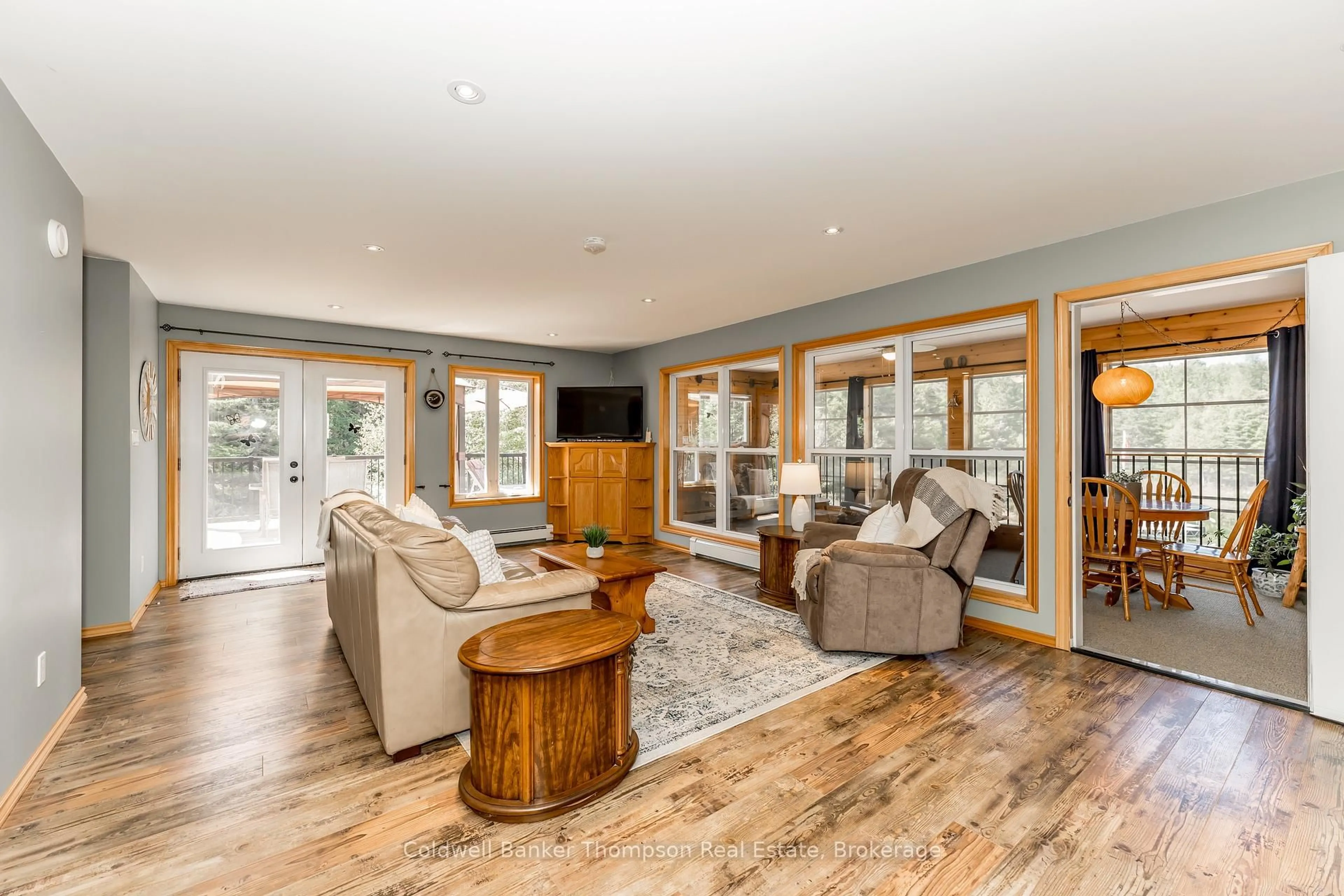 Living room with furniture, wood/laminate floor for 57 Rattray Rd, Perry Ontario P0A 1J0