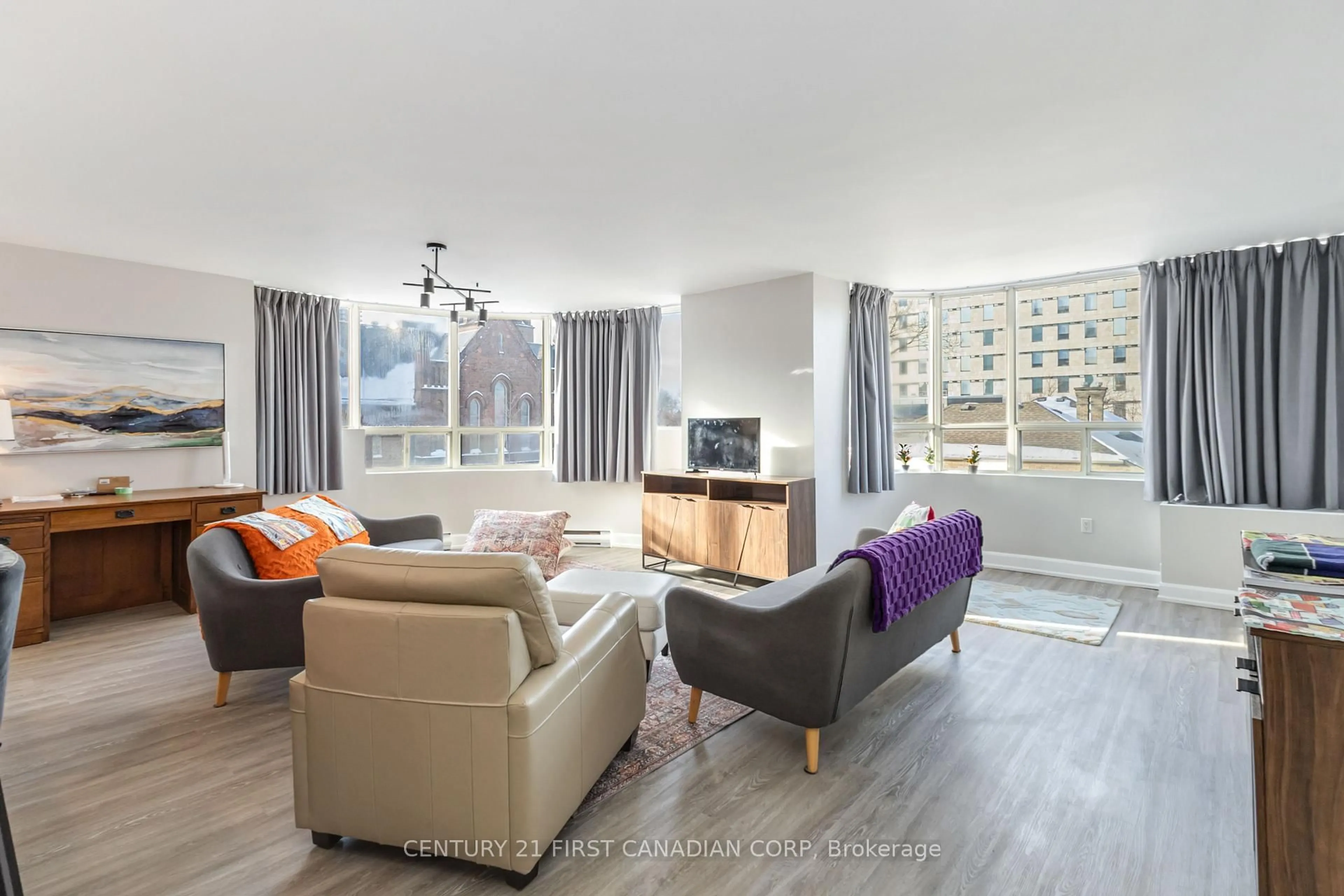 Living room with furniture, wood/laminate floor for 7 Picton St #403, London East Ontario N6B 3N7
