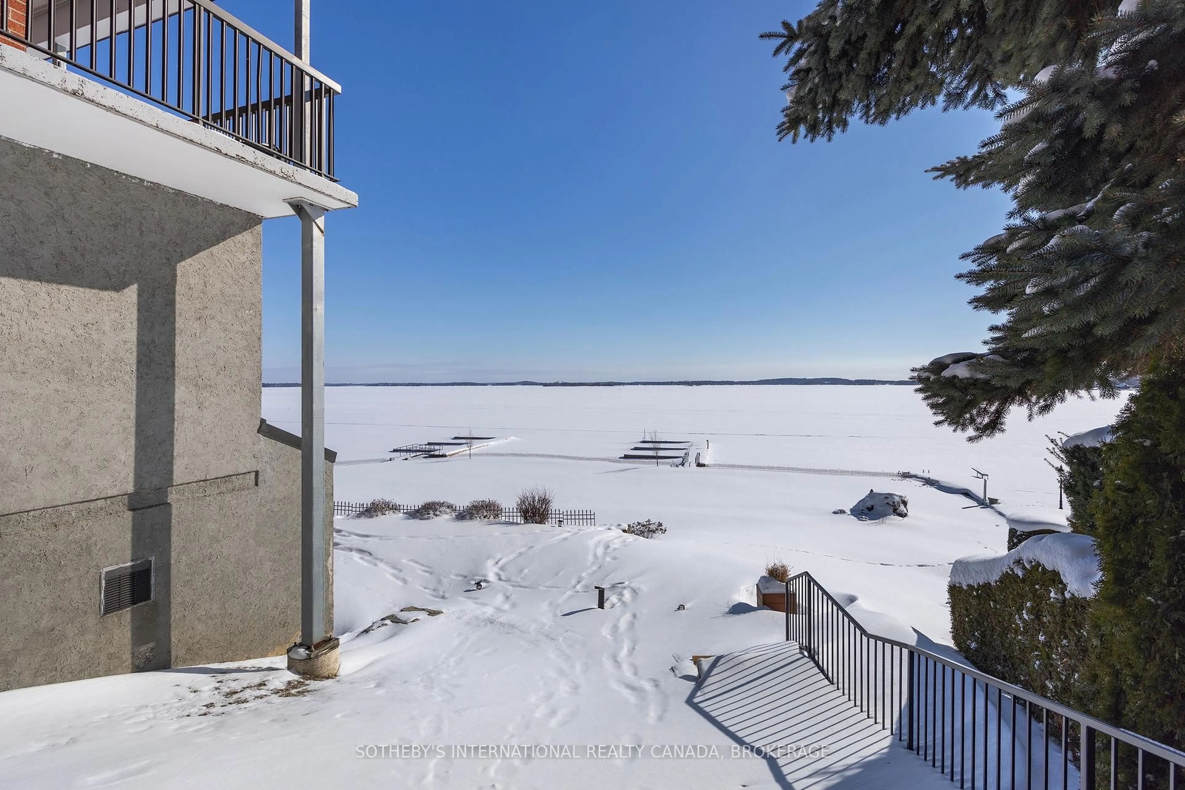 A pic from outside/outdoor area/front of a property/back of a property/a pic from drone, water/lake/river/ocean view for 235 South St #302, Gananoque Ontario K7G 1A4