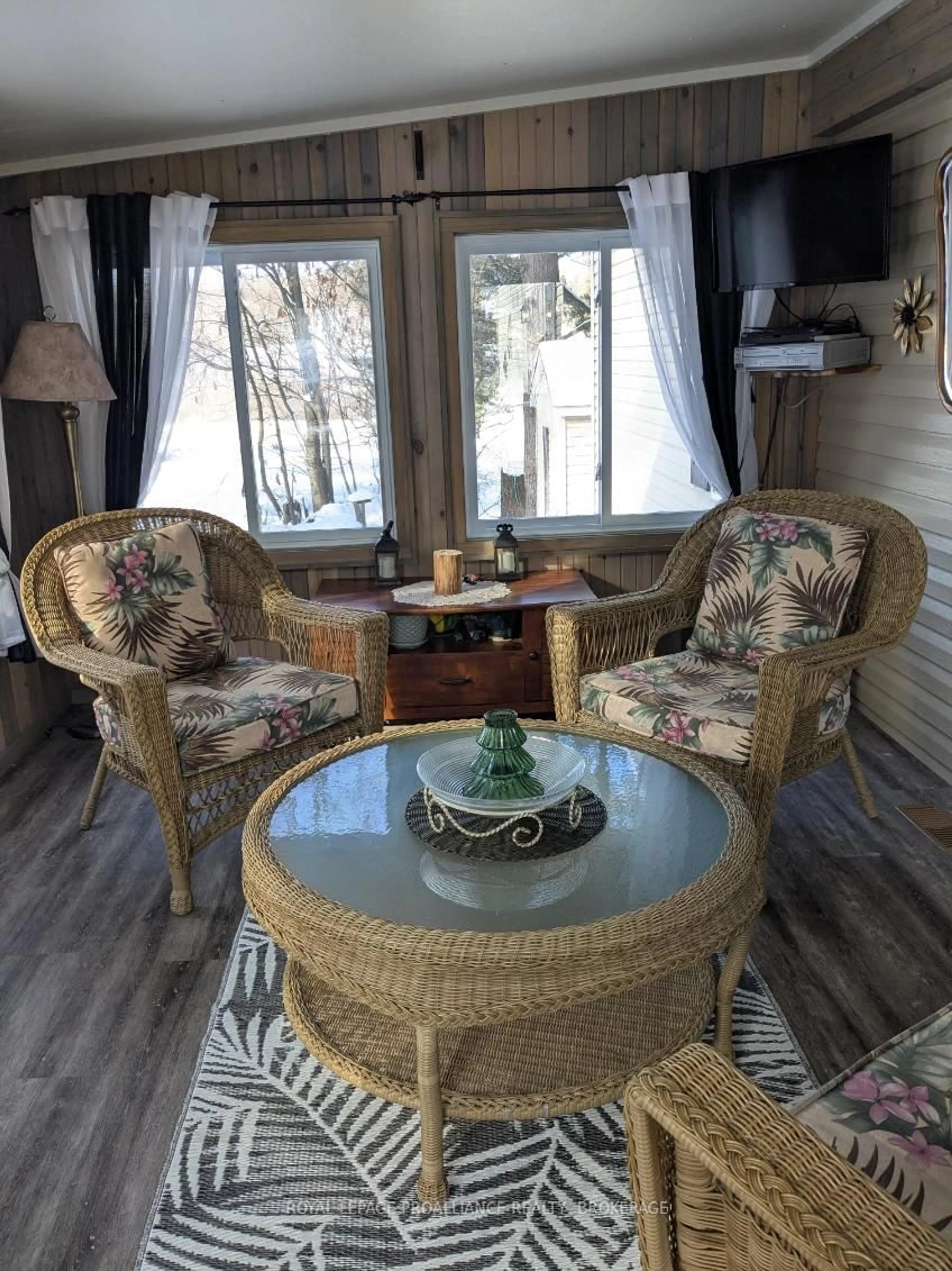 Living room with furniture, wood/laminate floor for 22-3302 Highway 32, Front of Leeds & Seeleys Bay Ontario K0H 2N0