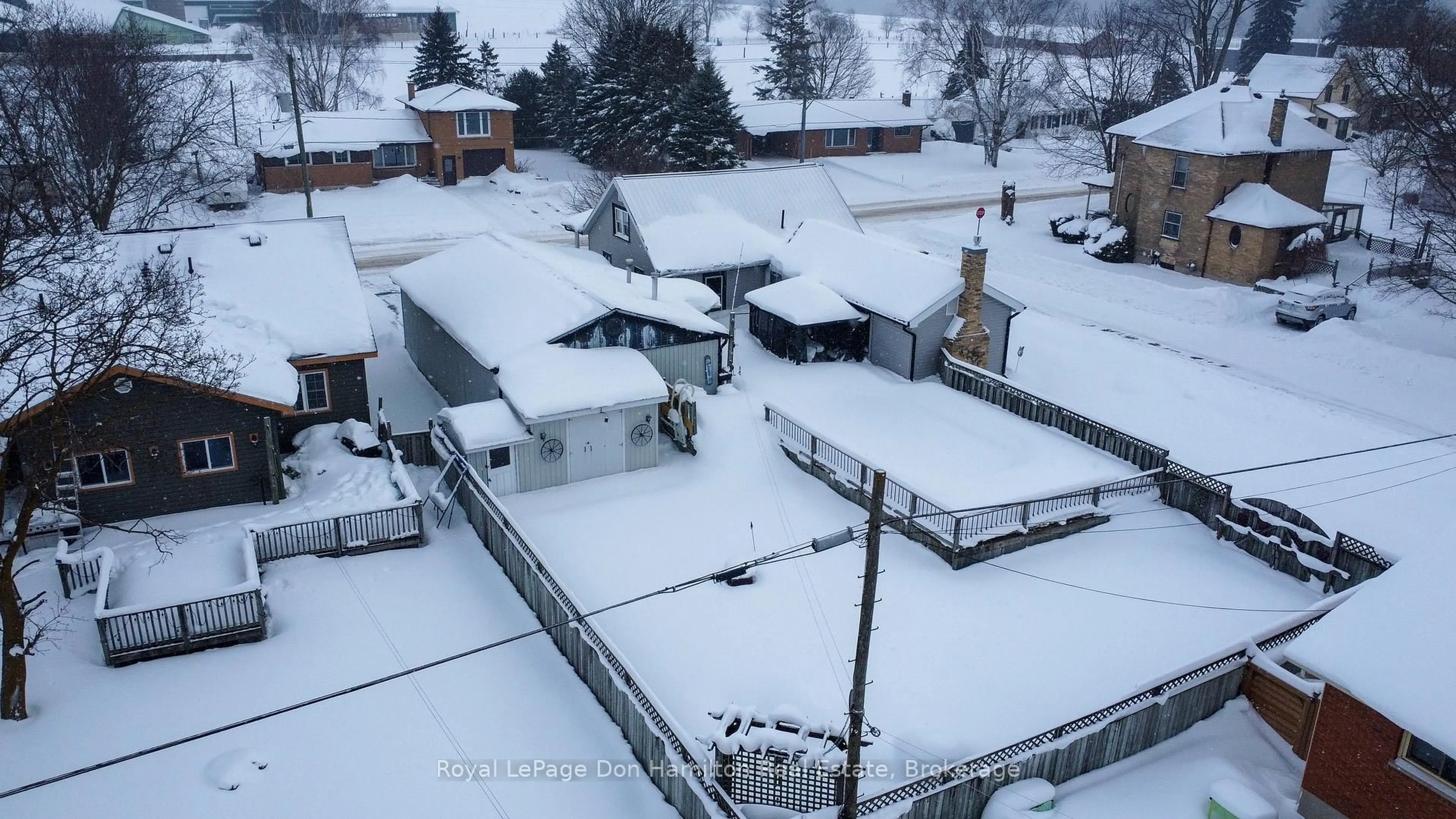 A pic from outside/outdoor area/front of a property/back of a property/a pic from drone, street for 64 George St, Minto Ontario N0G 1Z0