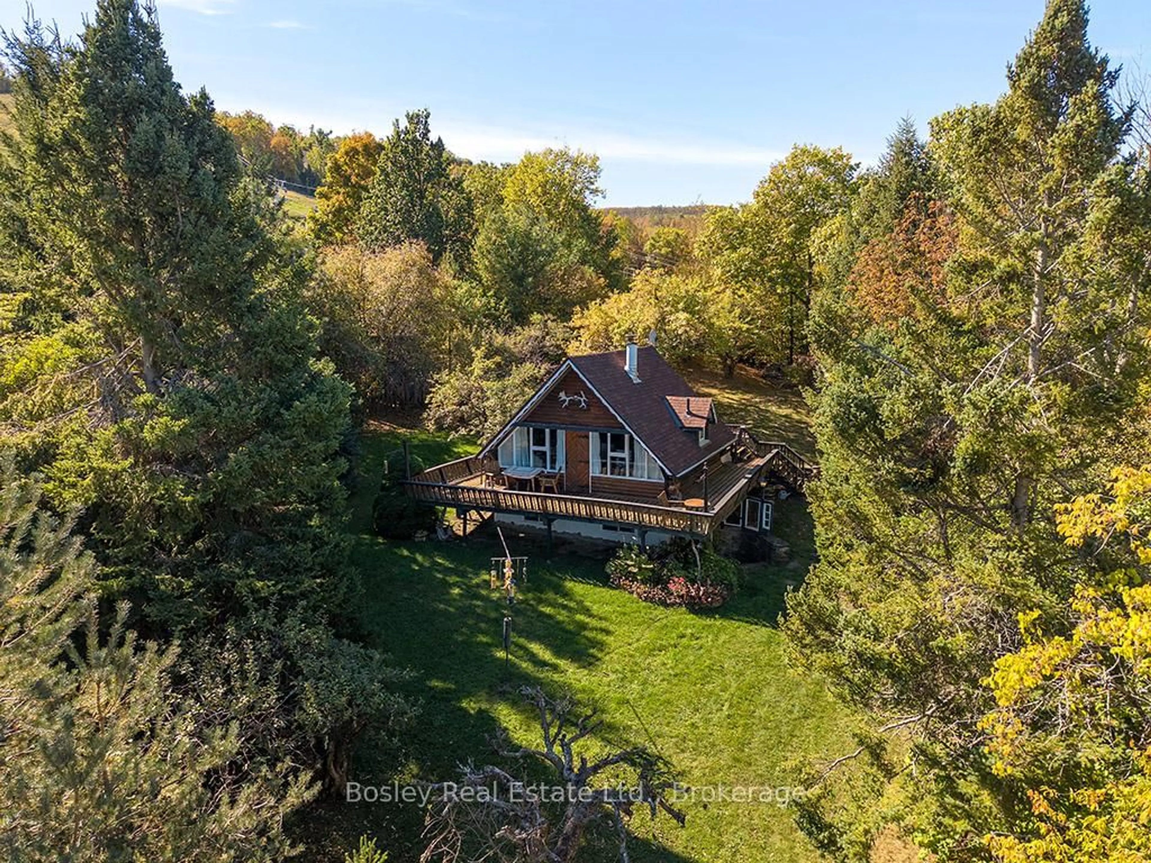 A pic from outside/outdoor area/front of a property/back of a property/a pic from drone, forest/trees view for 242 Arrowhead Rd #3, Blue Mountains Ontario L9Y 0S1