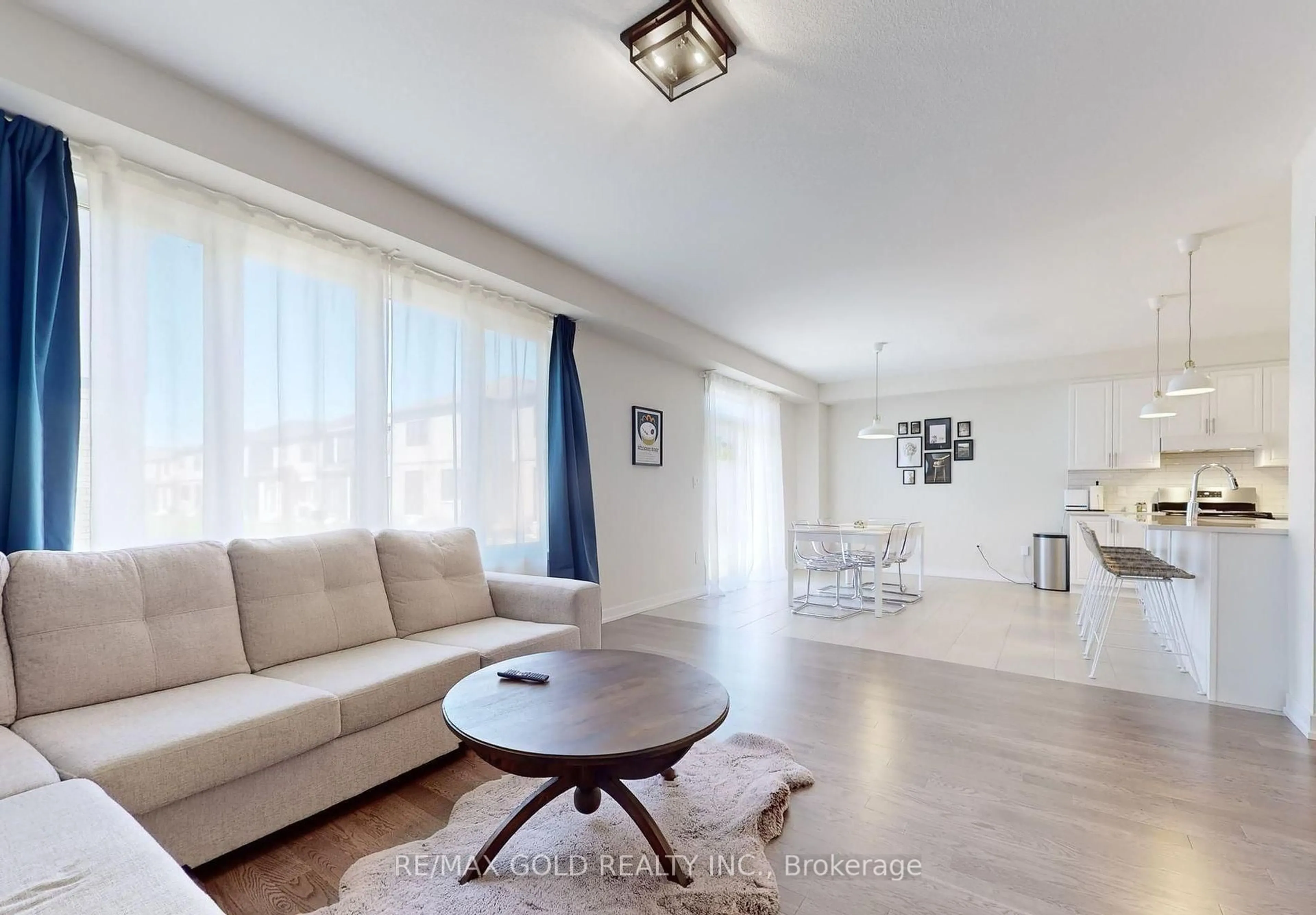 Living room with furniture, wood/laminate floor for 71 Lavender Rd, Thorold Ontario L3B 0K9