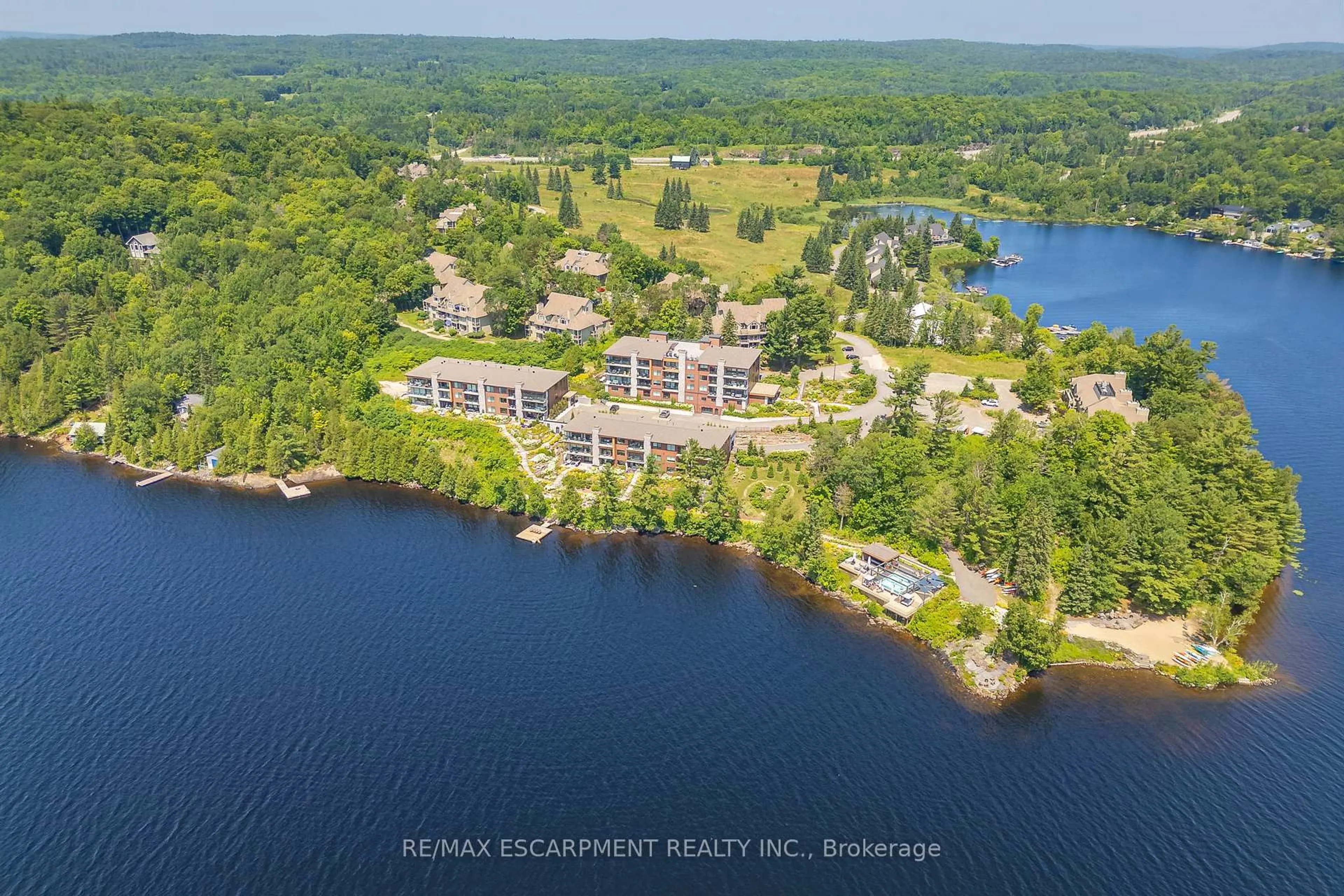 A pic from outside/outdoor area/front of a property/back of a property/a pic from drone, water/lake/river/ocean view for 131 Grandview Hilltop Dr #1, Huntsville Ontario P1H 2J5