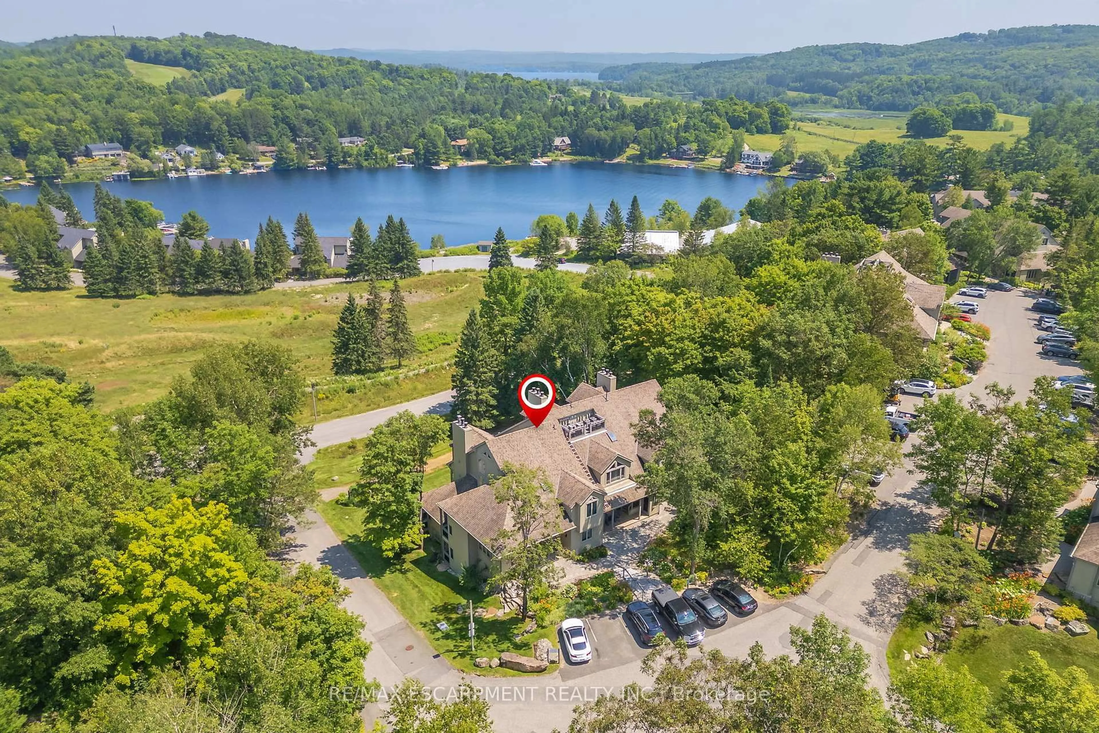 A pic from outside/outdoor area/front of a property/back of a property/a pic from drone, water/lake/river/ocean view for 131 Grandview Hilltop Dr #1, Huntsville Ontario P1H 2J5