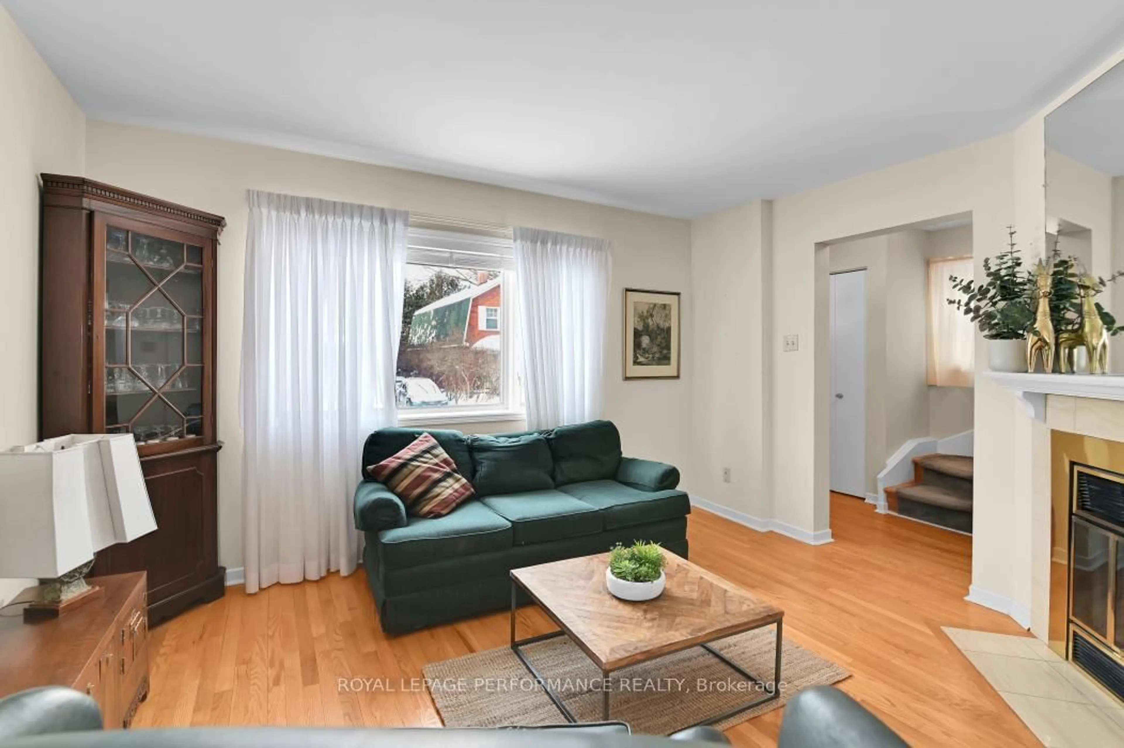 Living room with furniture, wood/laminate floor for 6 Elmdale Ave, Ottawa Ontario K1M 1A4