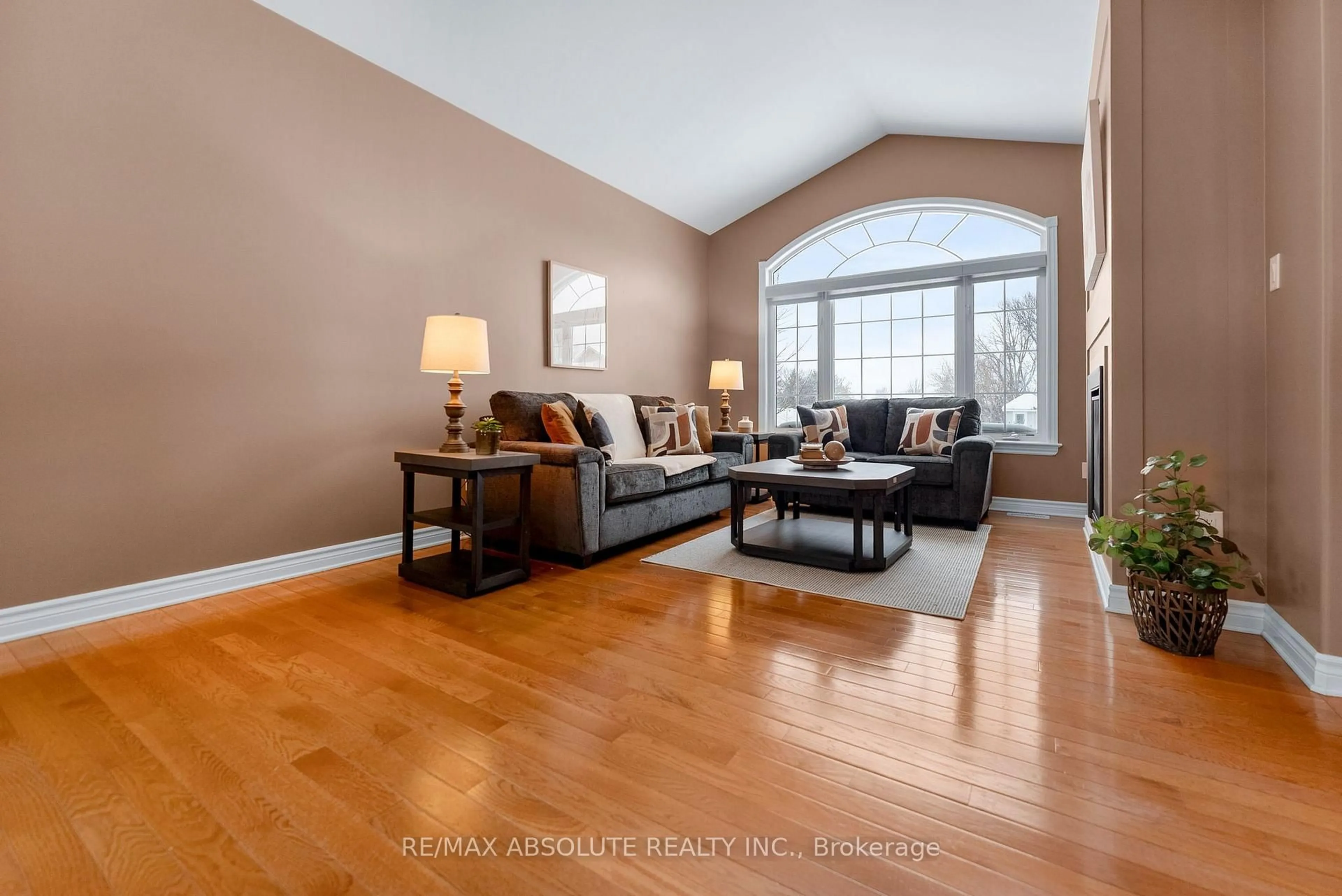 Living room with furniture, wood/laminate floor for 215 Arthur St, Arnprior Ontario K7S 0H6